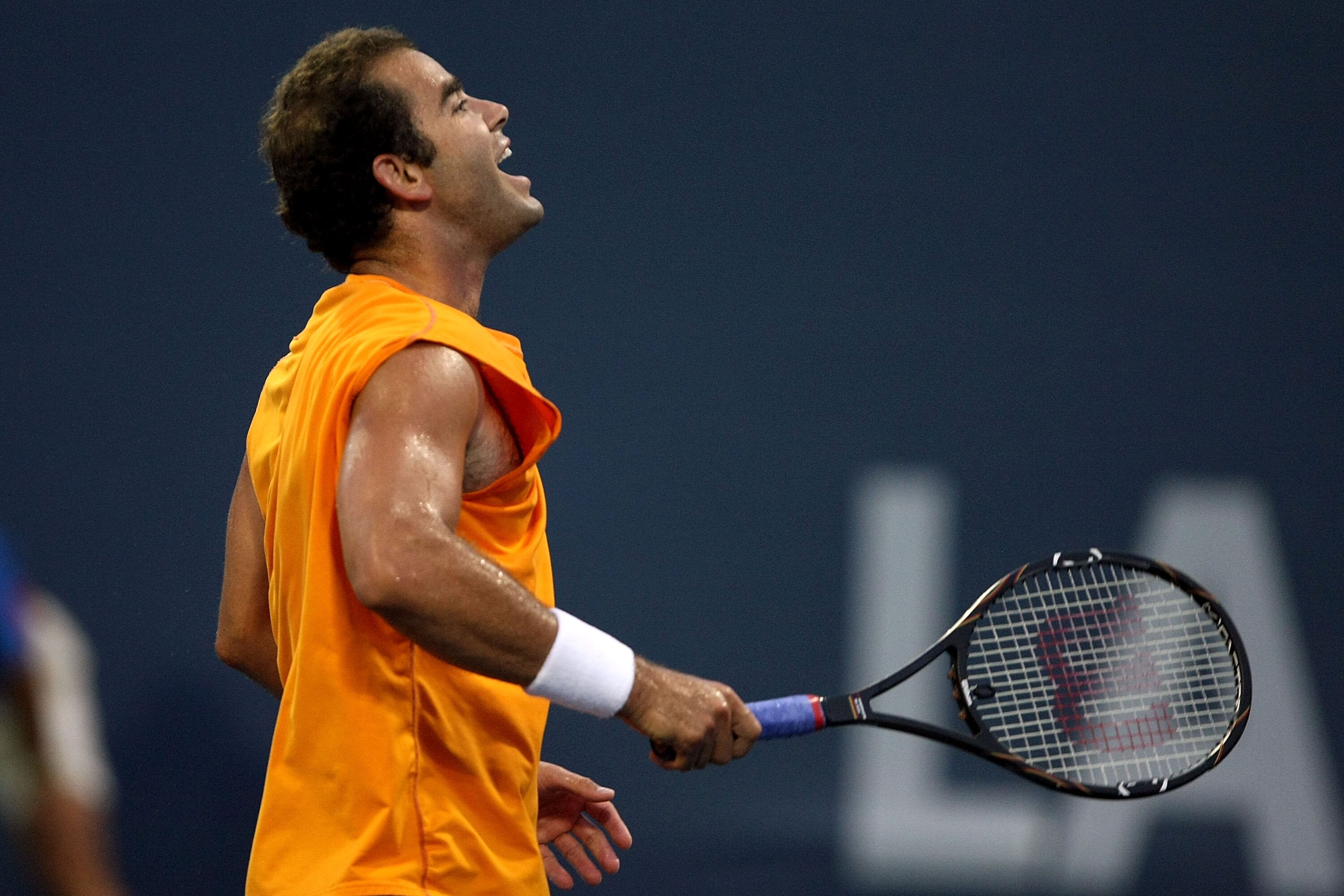 LOS ANGELES, CA - JULY 27:  Tournament honoree Pete Sampras yells while taking on Marat Safin in the ï¿½Millennium Challengeï¿½ during the LA Tennis Open Day 1 at Los Angeles Tennis Center - UCLA on July 27, 2009 in Los Angeles, California.  (Photo by Stephen