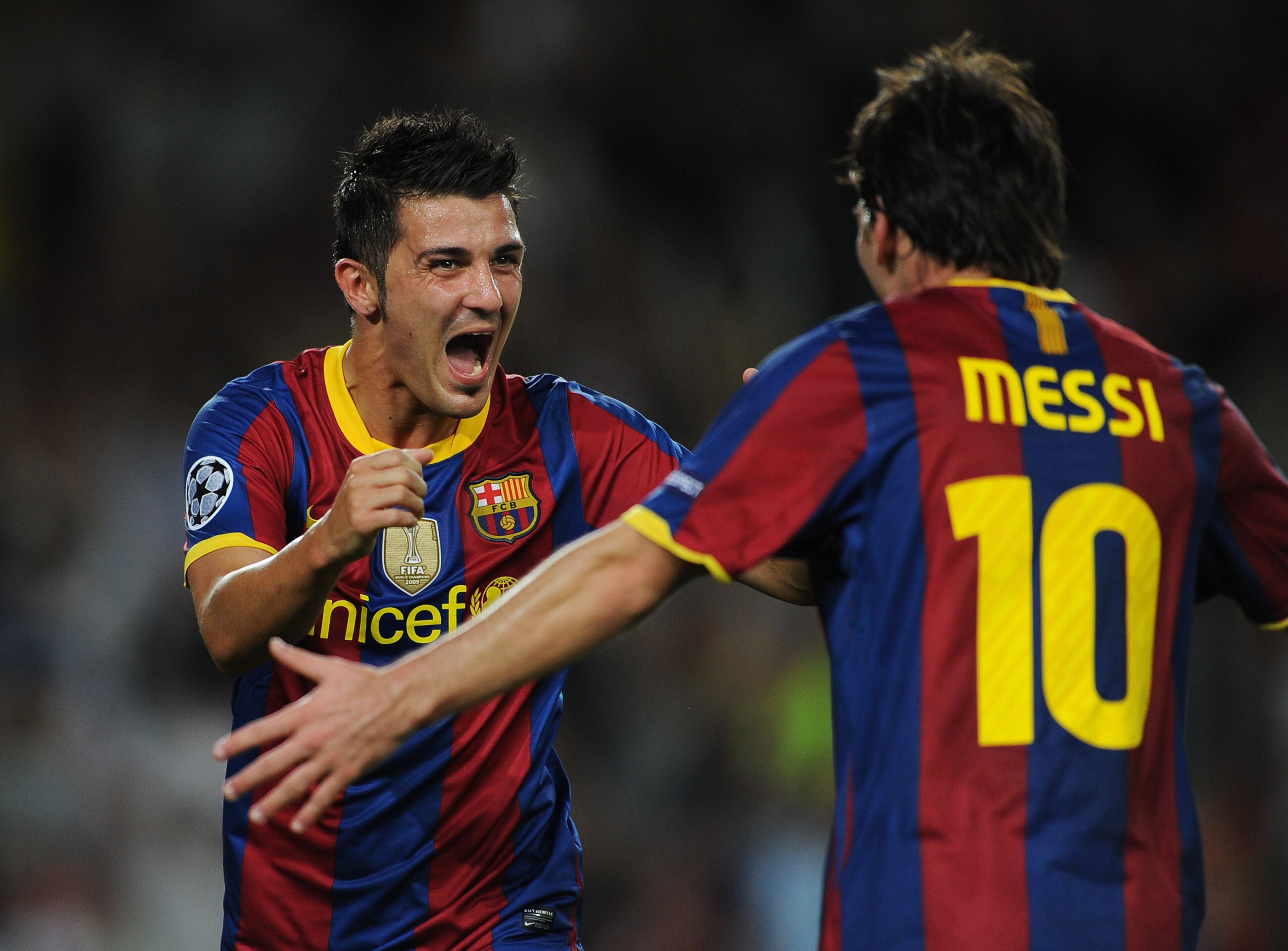 BARCELONA, SPAIN - SEPTEMBER 14: David Villa (L) of Barcelona celebrates scoring his sides second goal with his teammate Lionel Messi during the UEFA Champions League group D match between Barcelona and Panathinaikos on September 14, 2010 in Barcelona, S BARCELONA, SPAIN - SEPTEMBER 14: David Villa (L) of Barcelona celebrates scoring his sides second goal with his teammate Lionel Messi during the UEFA Champions League group D match between Barcelona and Panathinaikos on September 14, 2010 in Barcelona, S