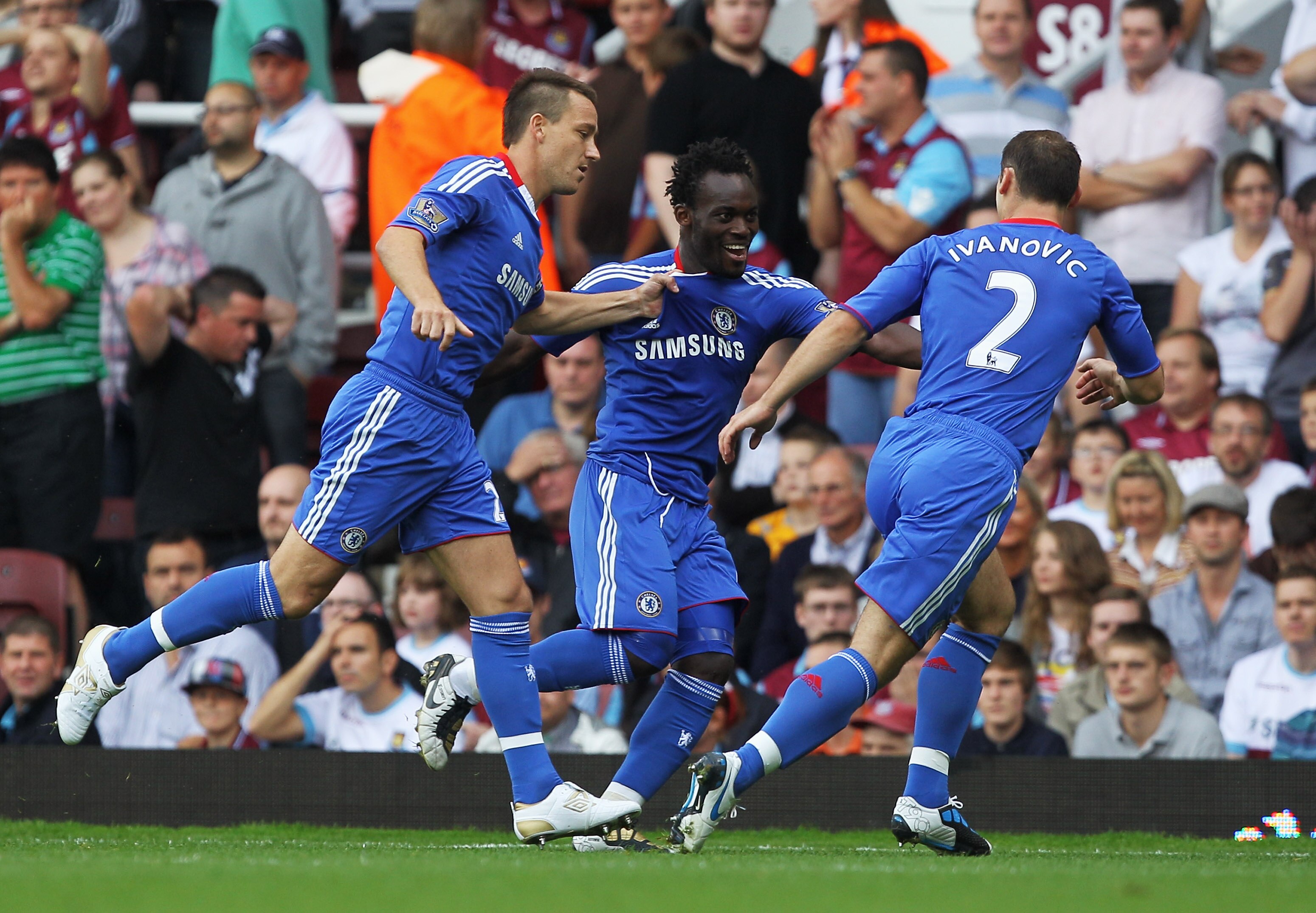 LONDON, ENGLAND - SEPTEMBER 11: Michael Essien of Chelsea (C) celebrates with John Terry (L) and Branislav Ivanovic as he scores their first goal during the Barclays Premier League match between West Ham United and Chelsea at the Boleyn Ground on Septemb LONDON, ENGLAND - SEPTEMBER 11: Michael Essien of Chelsea (C) celebrates with John Terry (L) and Branislav Ivanovic as he scores their first goal during the Barclays Premier League match between West Ham United and Chelsea at the Boleyn Ground on Septemb