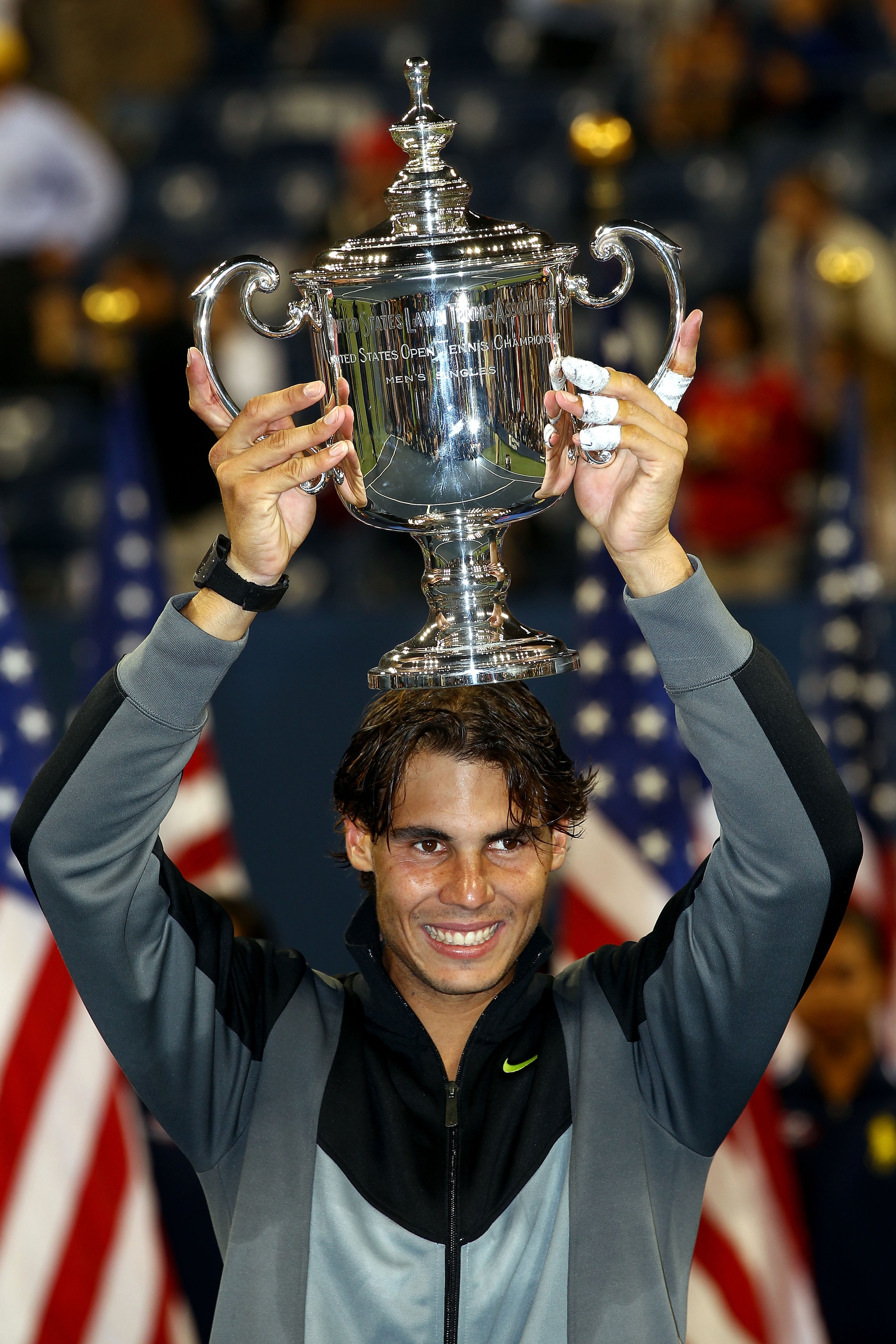 NEW YORK - SEPTEMBER 13:  Rafael Nadal of Spain celebrates with the championship trophy after defeating Novak Djokovic of Serbia to win the men's singles final on day fifteen of the 2010 U.S. Open at the USTA Billie Jean King National Tennis Center on Sep