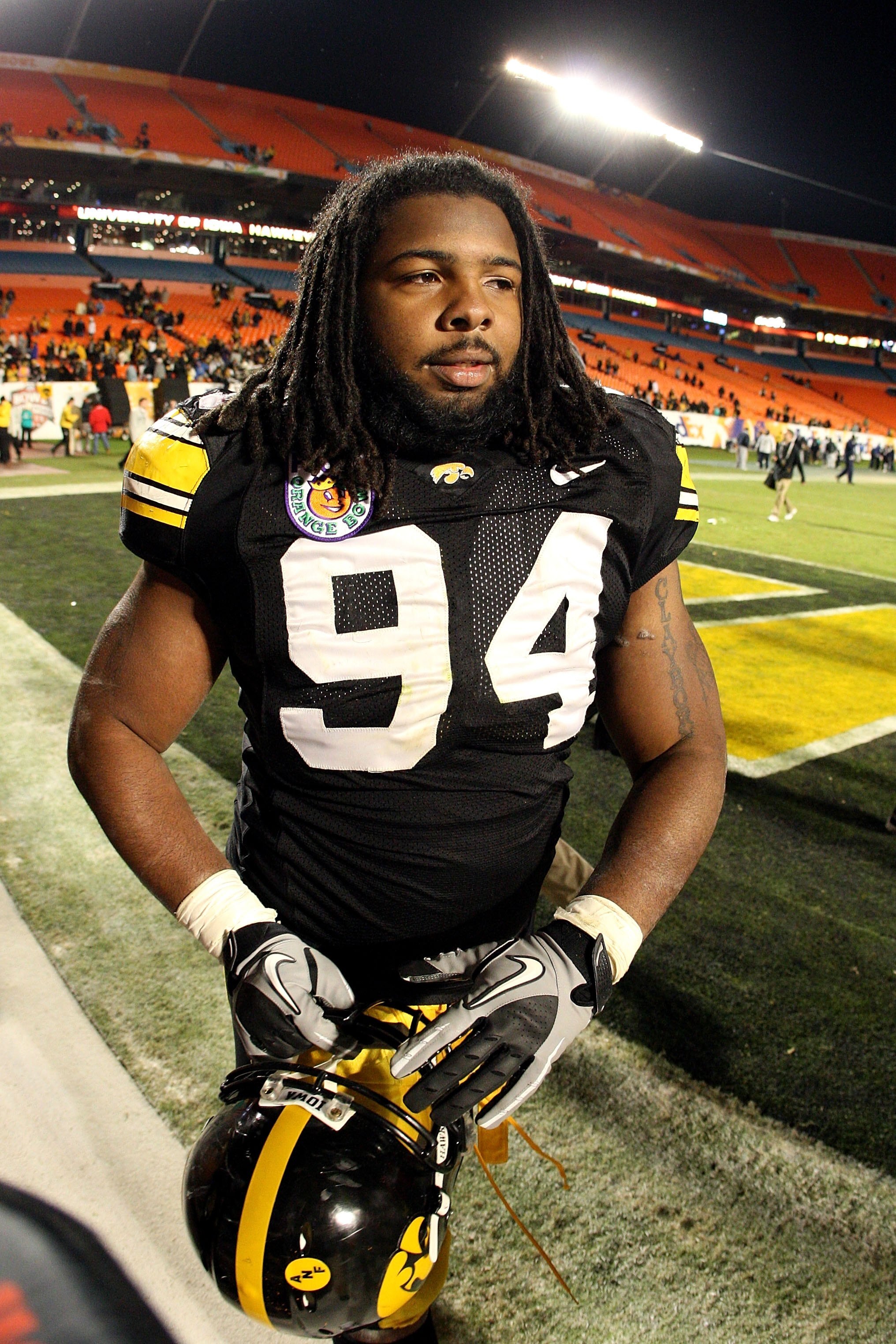 MIAMI GARDENS, FL - JANUARY 05:  Adrian Clayborn #94 of the Iowa Hawkeyes walks off the field after their 24-14 win against the Georgia Tech Yellow Jackets during the FedEx Orange Bowl at Land Shark Stadium on January 5, 2010 in Miami Gardens, Florida.  (
