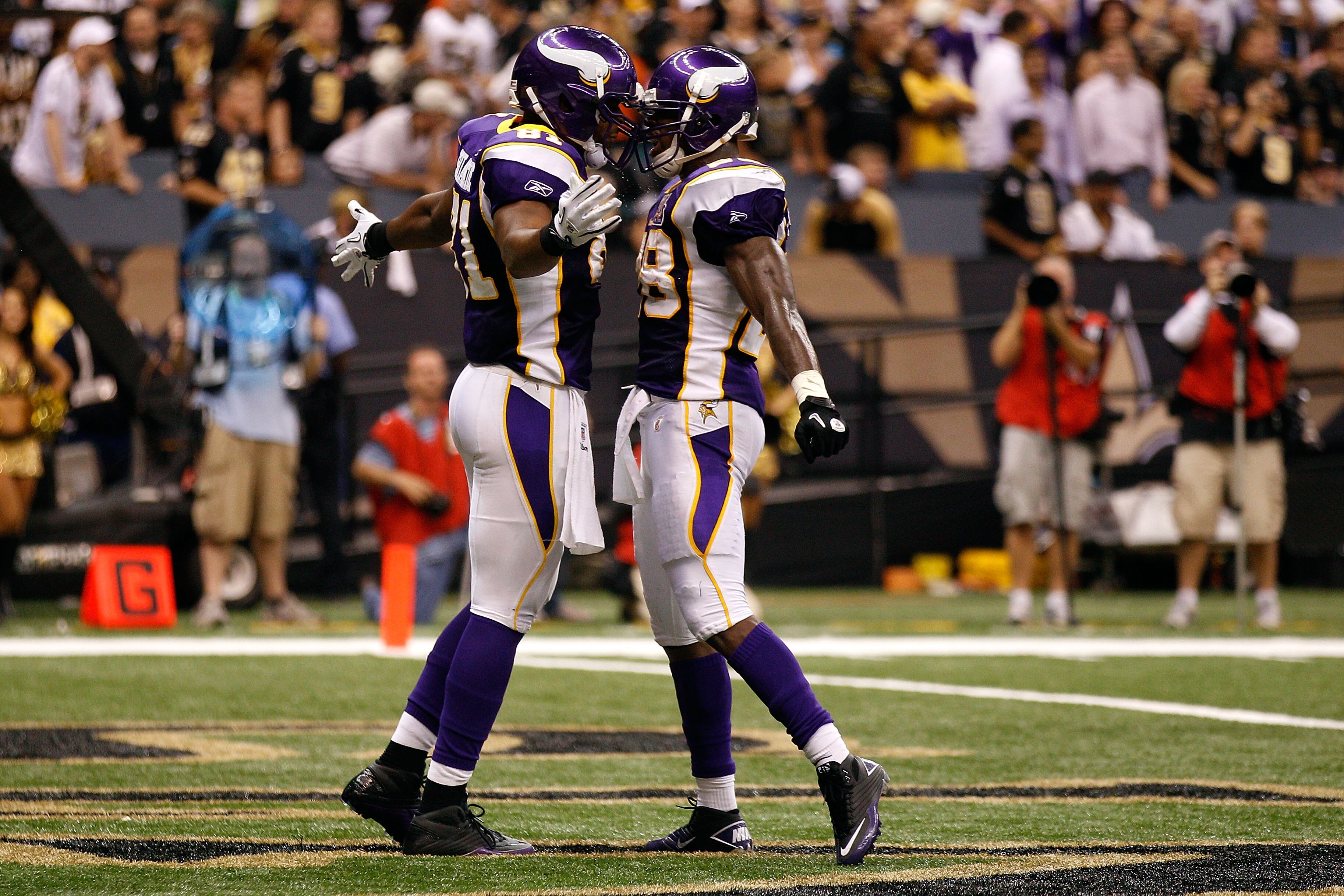 NEW ORLEANS - SEPTEMBER 09:  (L-R) Visanthe Shiancoe #81 and Adrian Peterson #28 of the Minnesota Vikings celebrate after Shiancoe scored a 20-yard touchdown reception in the second quarter against the New Orleans Saints at Louisiana Superdome on Septembe