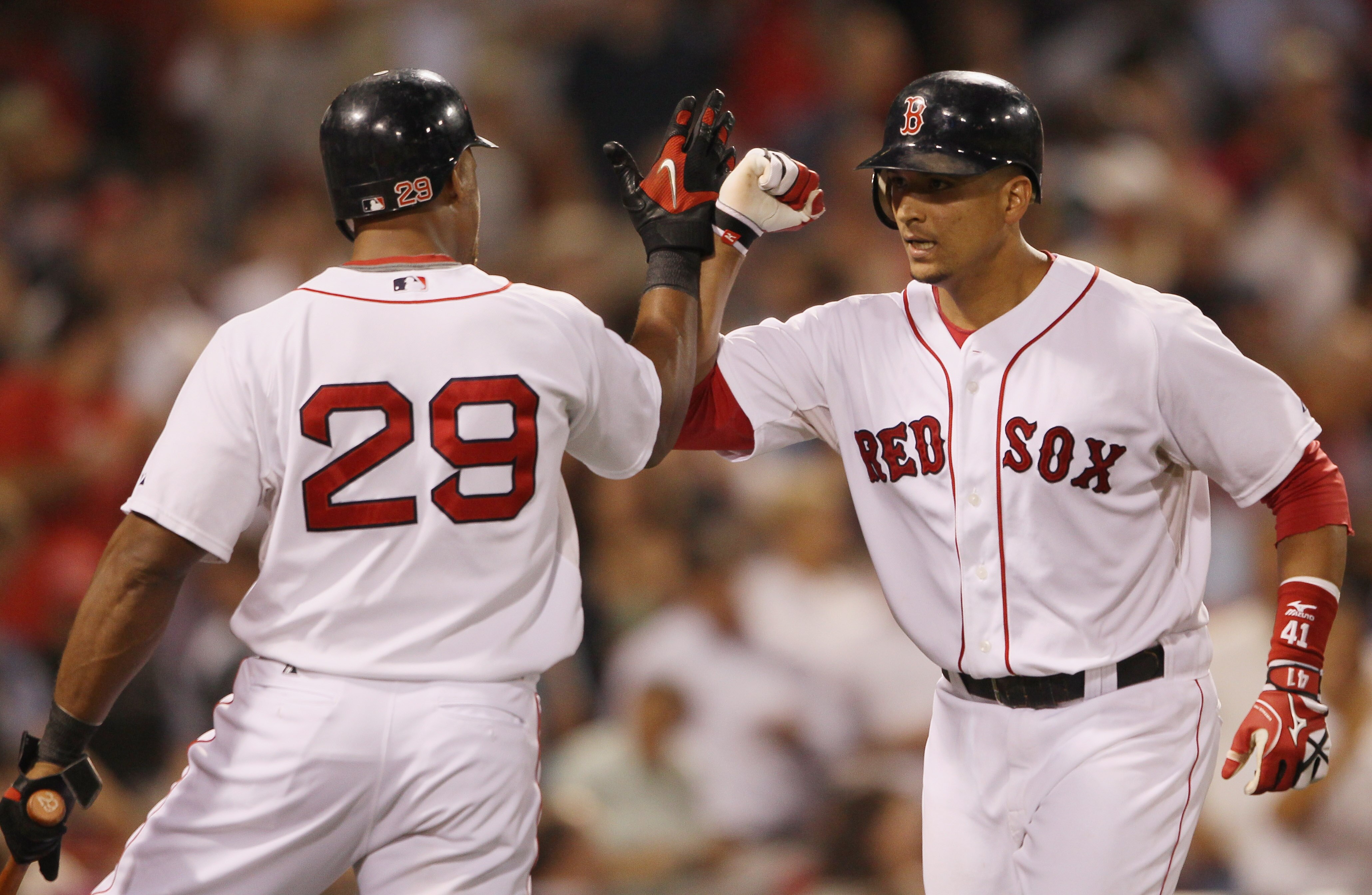 BOSTON - SEPTEMBER 08: Victor Martinez #41 of the Boston Red Sox is congratulated by teammate Adrian Beltre #29 after Martinez hit a solo home run against the Tampa Bay Rays on September 8, 2010 at Fenway Park in Boston, Massachusetts.  (Photo by Elsa/Get