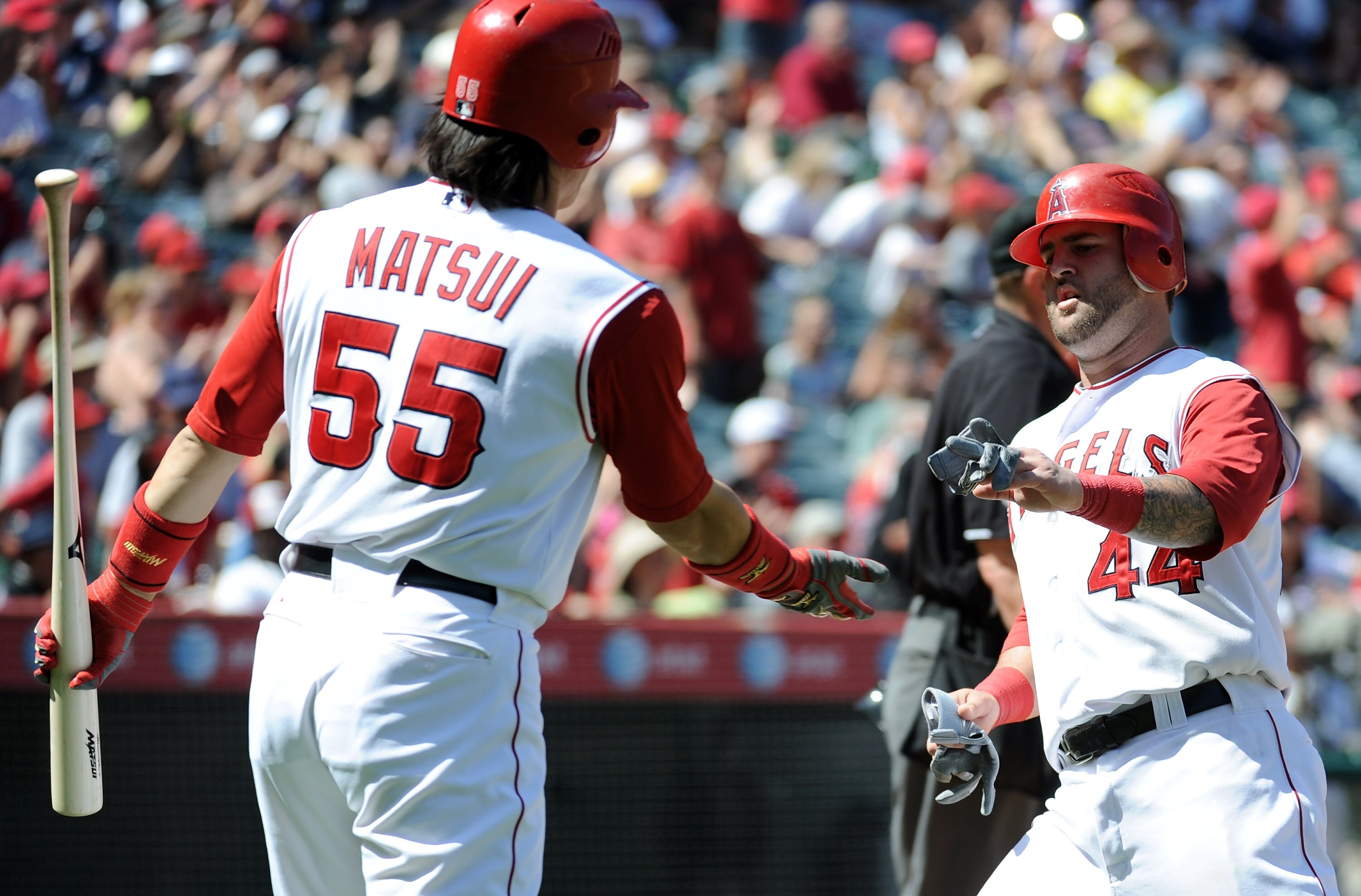 ANAHEIM, CA - SEPTEMBER 12:  Mike Napoli #44 of the Los Angeles Angels of Anaheim celebrates his run for a 2-0 lead over the Seattle Mariners with Hideki Matsui #55 during the sixth inning at Angel Stadium on September 12, 2010 in Anaheim, California.  (P