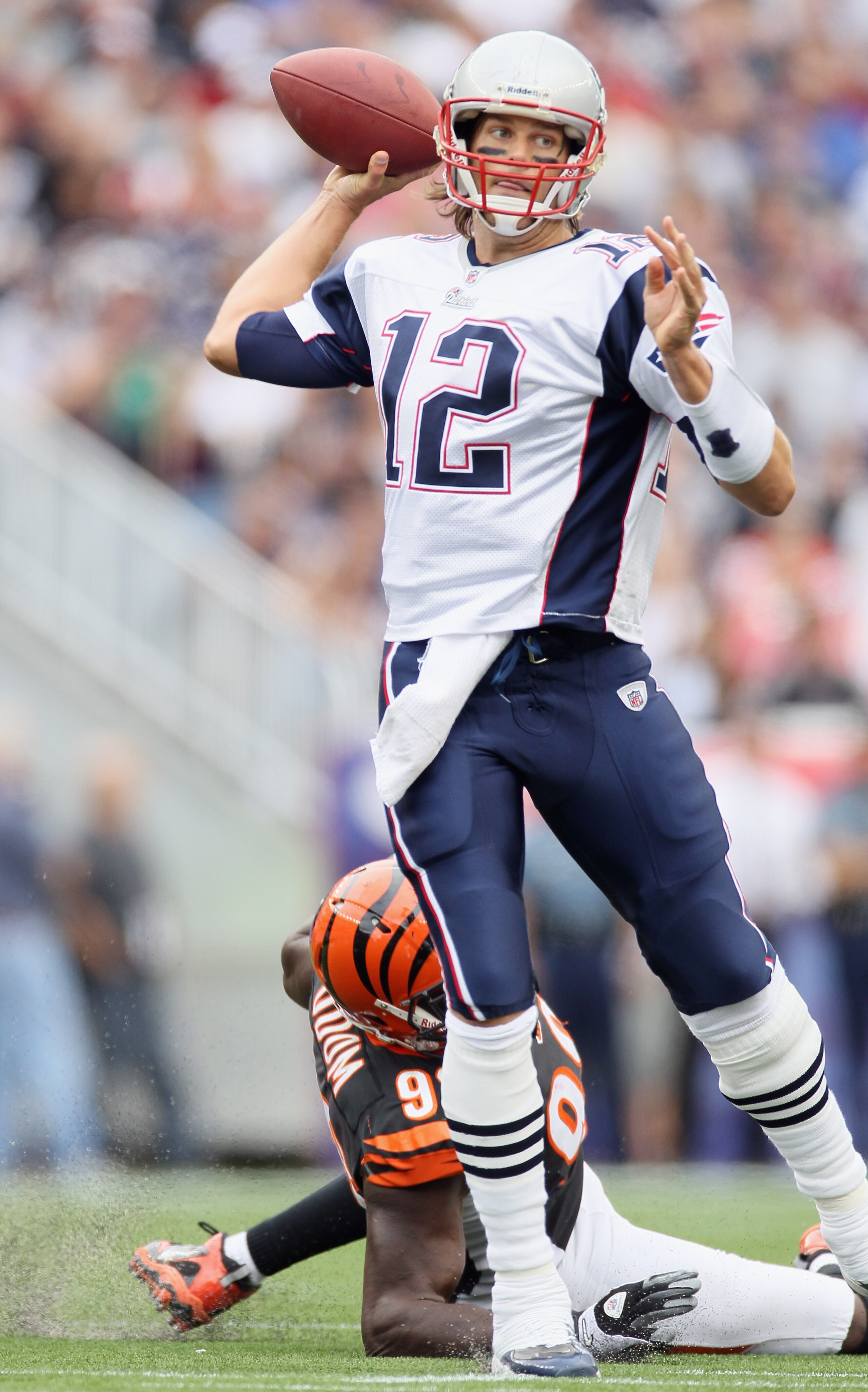 FOXBORO, MA - SEPTEMBER 12: Tom Brady #12 of the New England Patriots scrambles as Antwan Odom #98 of the Cincinnati Bengals is unable to make the sack during the NFL season opener on September 12, 2010 at Gillette Stadium in Foxboro, Massachusetts. (Ph FOXBORO, MA - SEPTEMBER 12: Tom Brady #12 of the New England Patriots scrambles as Antwan Odom #98 of the Cincinnati Bengals is unable to make the sack during the NFL season opener on September 12, 2010 at Gillette Stadium in Foxboro, Massachusetts. (Ph