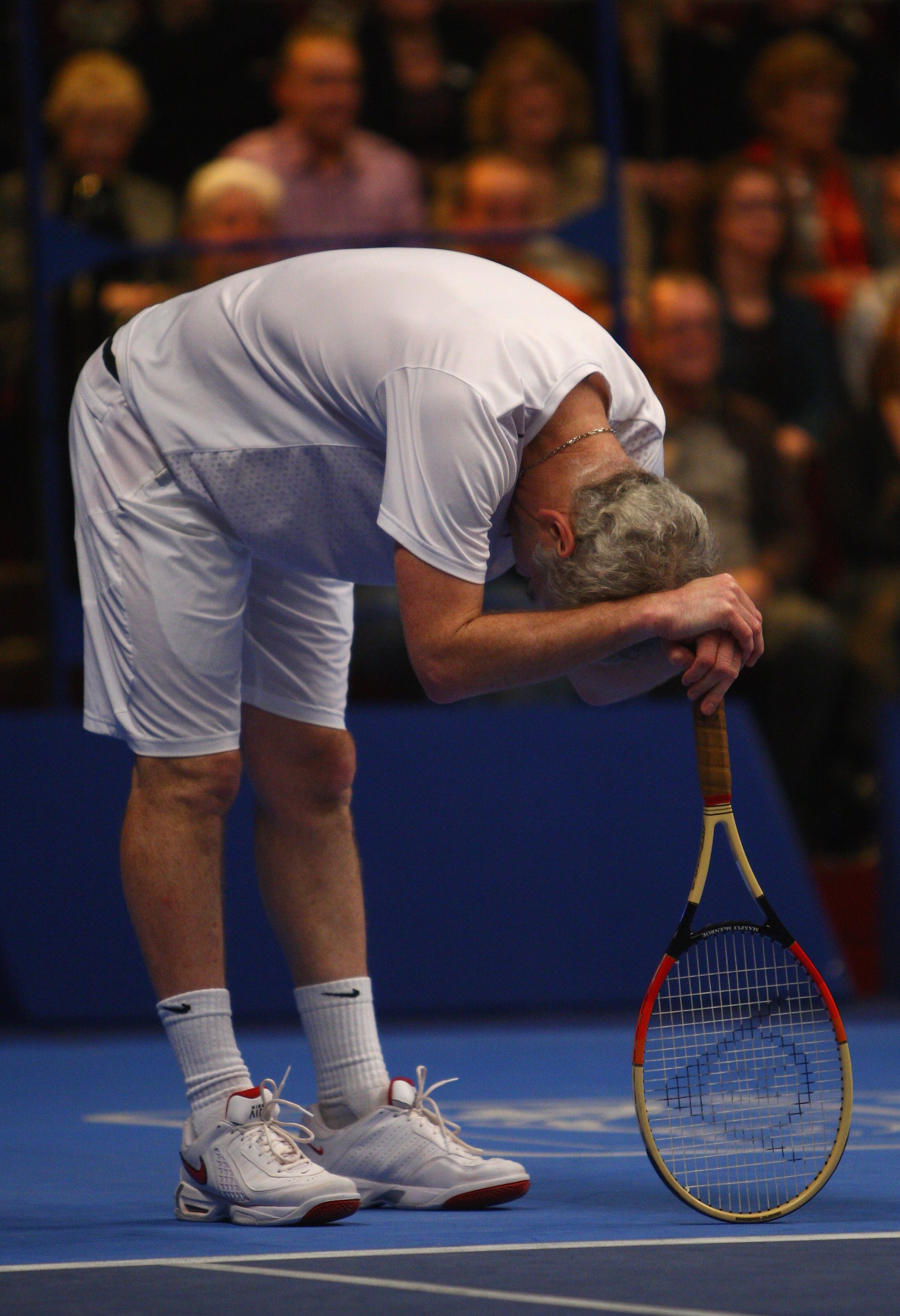 LONDON - DECEMBER 06:  A frustrated John McEnroe of United States in his match against Jeremy Bates of Great Britain during the BlackRock Masters Tennis at the Royal Albert Hall on December 6, 2008 in London, England.  (Photo by Julian Finney/Getty Images