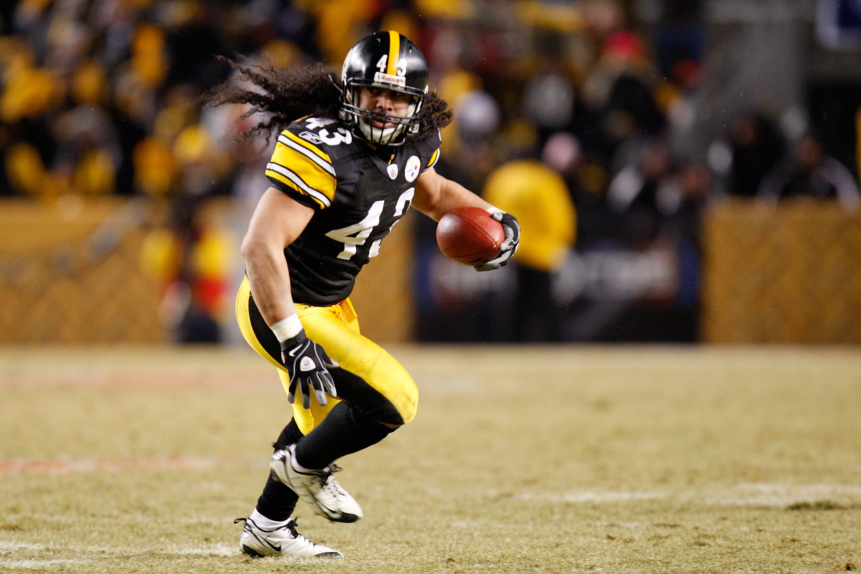 PITTSBURGH - JANUARY 18:  Troy Polamalu #43 of the Pittsburgh Steelers returns an interception 40 yards for a touchdown against the Baltimore Ravens during the fourth quarter of the AFC championship game on January 18, 2009 at Heinz Field in Pittsburgh, P