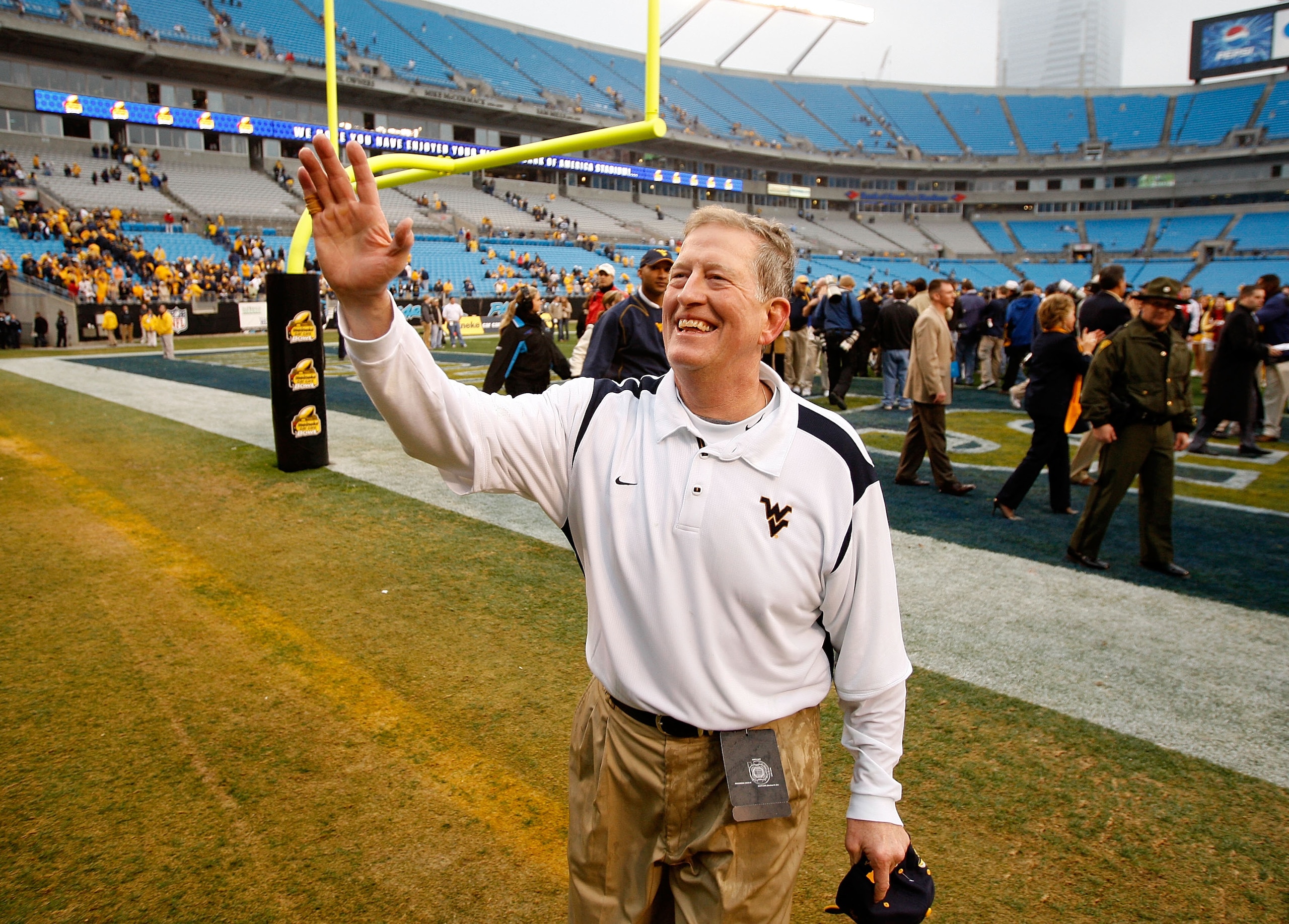 CHARLOTTE, NC - DECEMBER 27:  Head coach Bill Stewart of the West Virginia Mountaineers celebrates after a 31-30 victory over the North Carolina Tar Heels after the Meineke Car Care Bowl on December 27, 2008 at Bank of America Stadium in Charlotte, North 