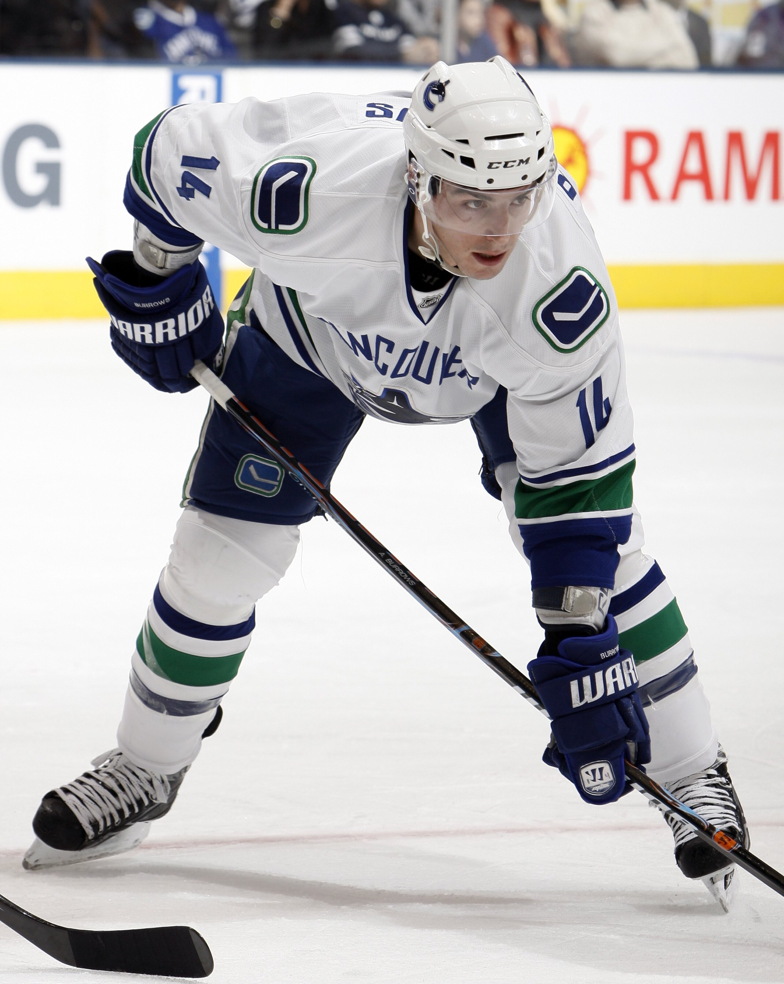 TORONTO - JANUARY 30: Alex Burrows #14 of the Vancouver Canucks gets ready for a face-off during game action against the Toronto Maple Leafs January 30, 2010 at the Air Canada Centre in Toronto, Ontario, Canada. (Photo by Abelimages / Getty Images)