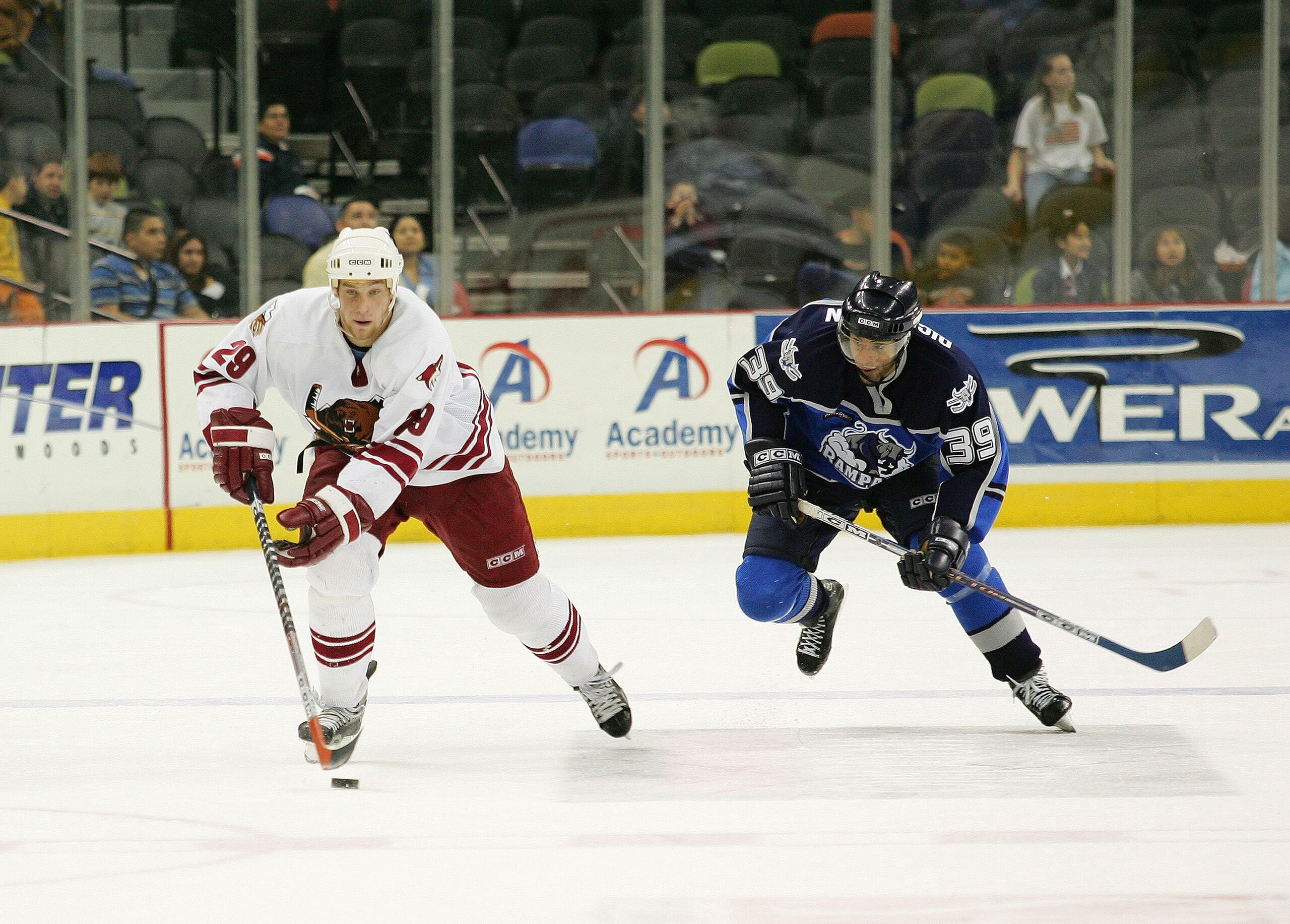 SAN ANTONIO - DECEMBER 9:  Jakub Koreis #29 of the Utah Grizzlies skates with the puck in the neutral zone against Lou Dickenson #39 of the San Antonio Rampage at SBC Center on December 9, 2004 in San Antonio, Texas.  The Rampage won 5-0.  (Photo by Darre