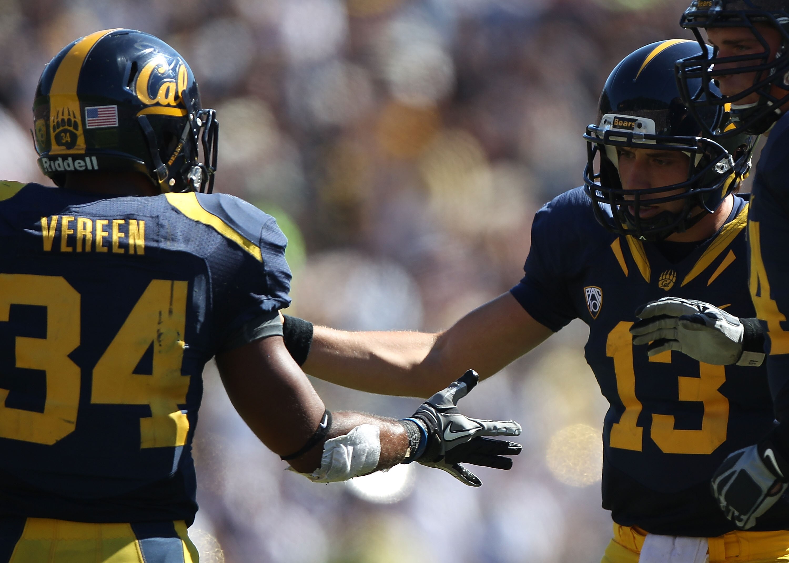 BERKELEY, CA - SEPTEMBER 11:  Kevin Riley #13 of the California Golden Bears celebrates with Shane Vereen #34 against the Colorado Buffaloes at California Memorial Stadium on September 11, 2010 in Berkeley, California.  (Photo by Jed Jacobsohn/Getty Image