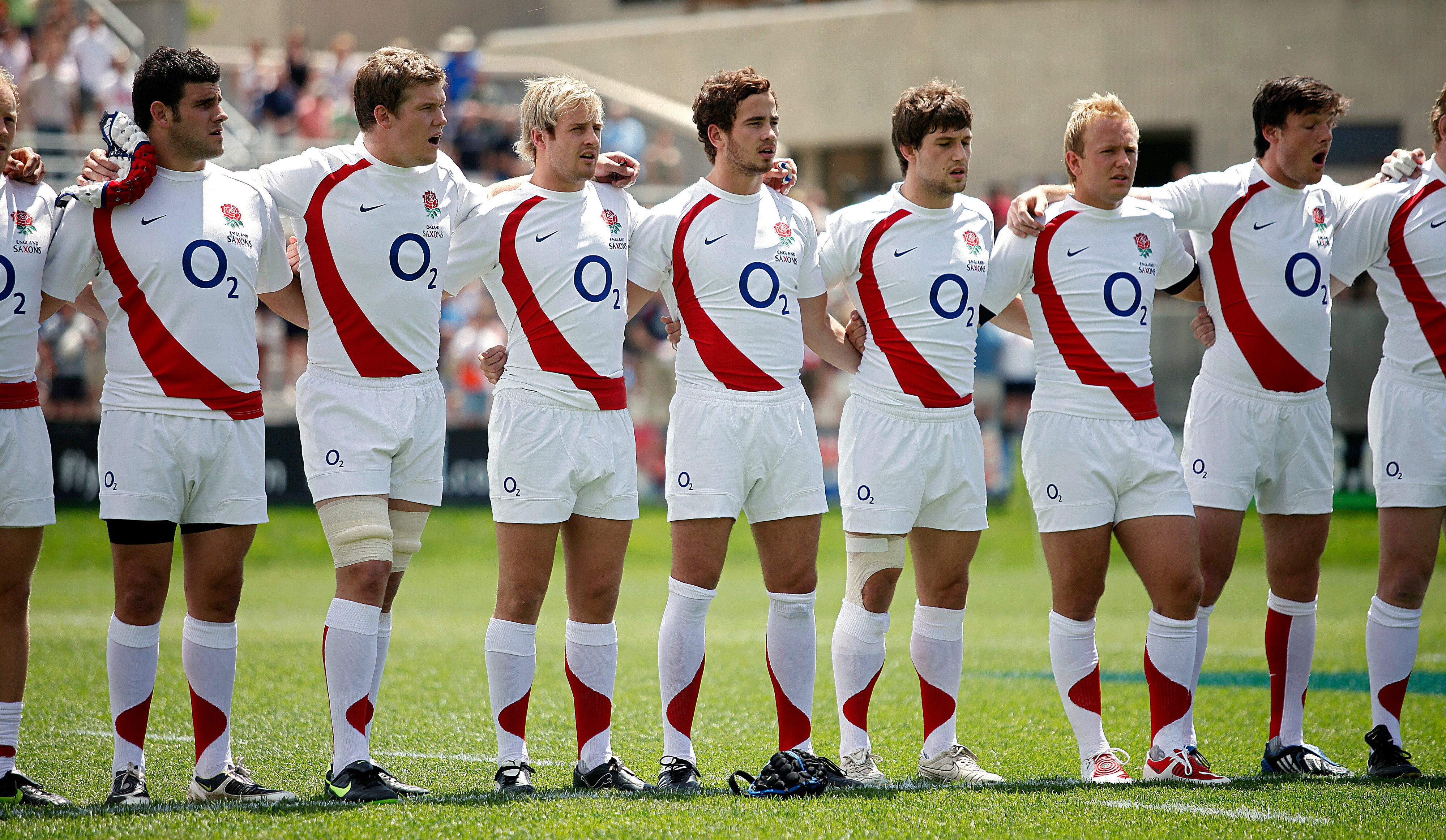 GLENDALE, CO - JUNE 6: England Saxons teammates sing the country's national anthem arm in arm as they prepare to play the Argentina Jaguars during the first half of their Churchill Cup match at Infinity Park on June 6, 2009 in Glendale, Colorado. The Engl