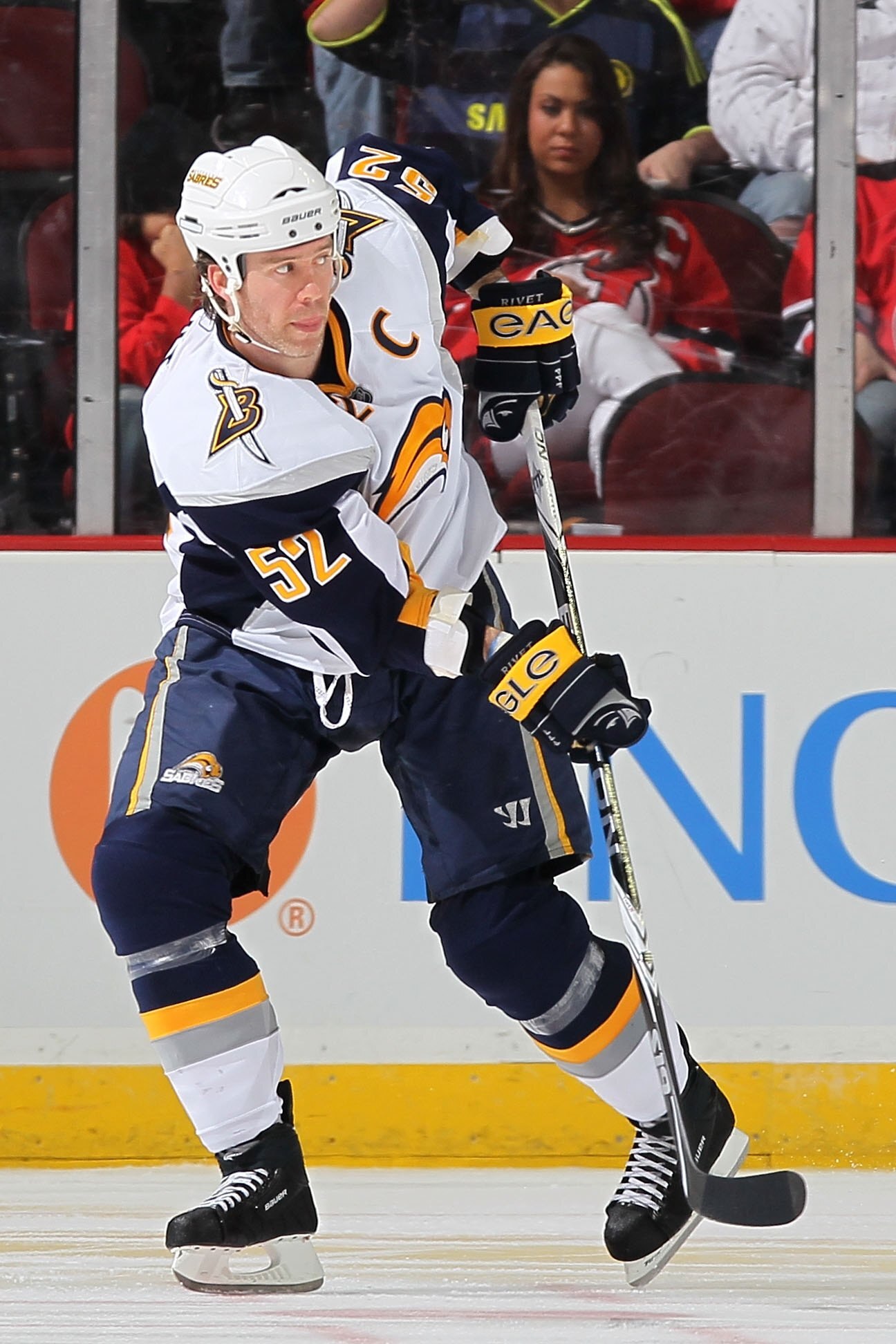 NEWARK, NJ - APRIL 11:  Craig Rivet #52 of the Buffalo Sabres attacks against the New Jersey Devils at the Prudential Center on April 11, 2010 in Newark, New Jersey.  (Photo by Chris McGrath/Getty Images)