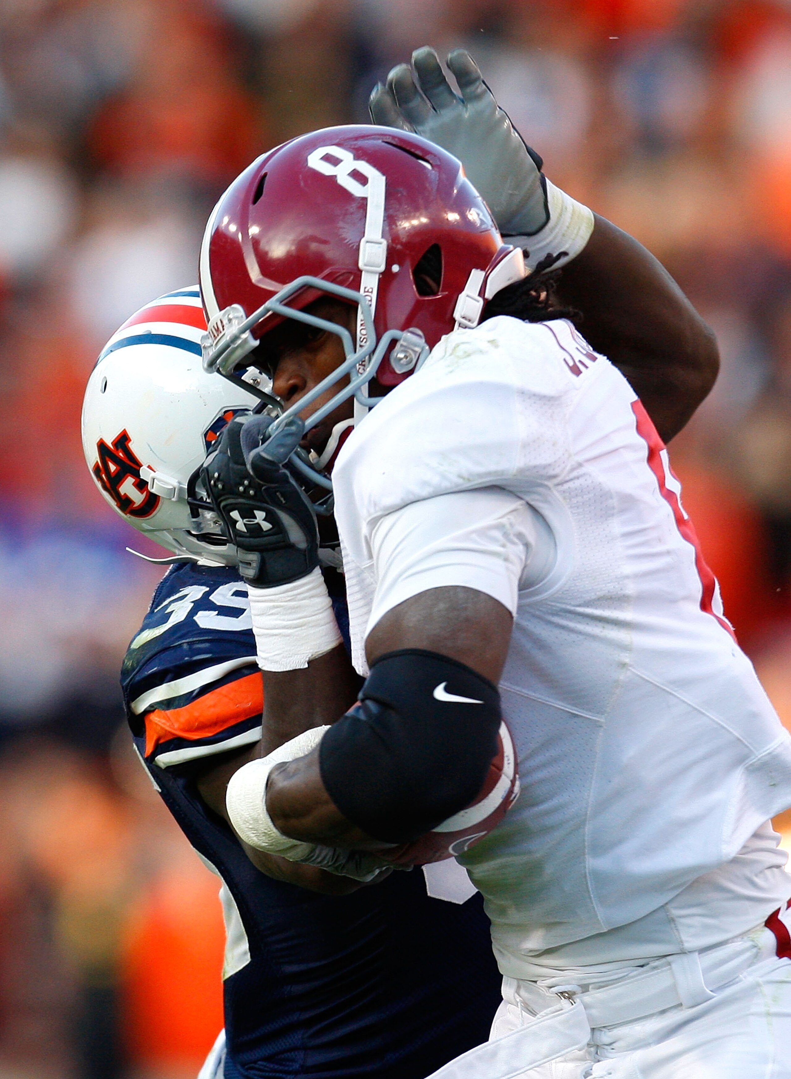 AUBURN, AL - NOVEMBER 27:  Julio Jones #8 of the Alabama Crimson Tide draws a facemask penalty from Jonathan Evans #35 of the Auburn Tigers at Jordan-Hare Stadium on November 27, 2009 in Auburn, Alabama.  (Photo by Kevin C. Cox/Getty Images)
