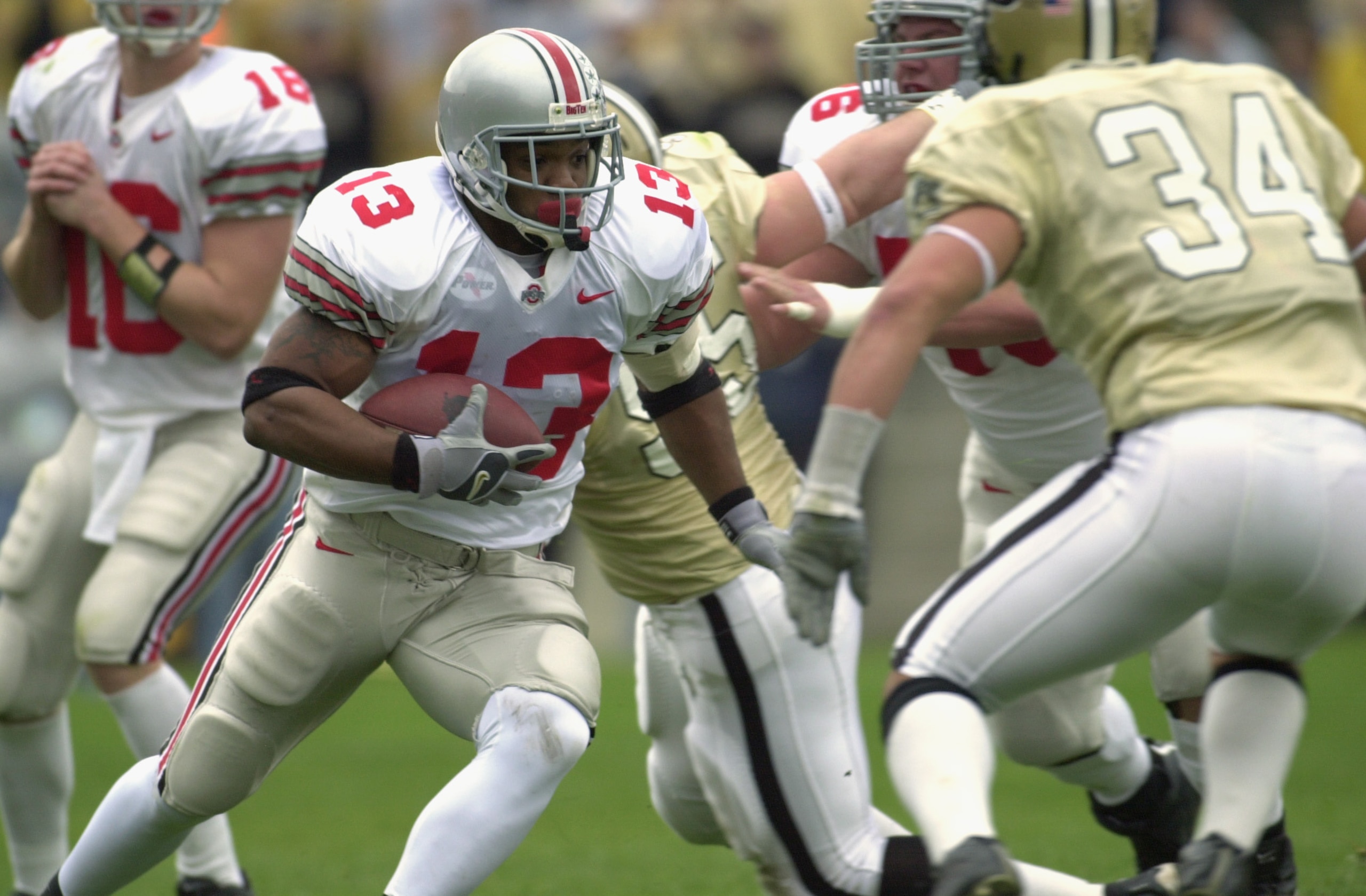 WEST LAFAYETTE, IN - NOVEMBER 9:  Tailback Maurice Clarett #13 of the Ohio State Buckeyes runs with the ball during the Big 10 Conference football game against the Purdue Boilermakers at Ross-Ade Stadium on November 9, 2002 in West Lafayette, Indiana. (Ph