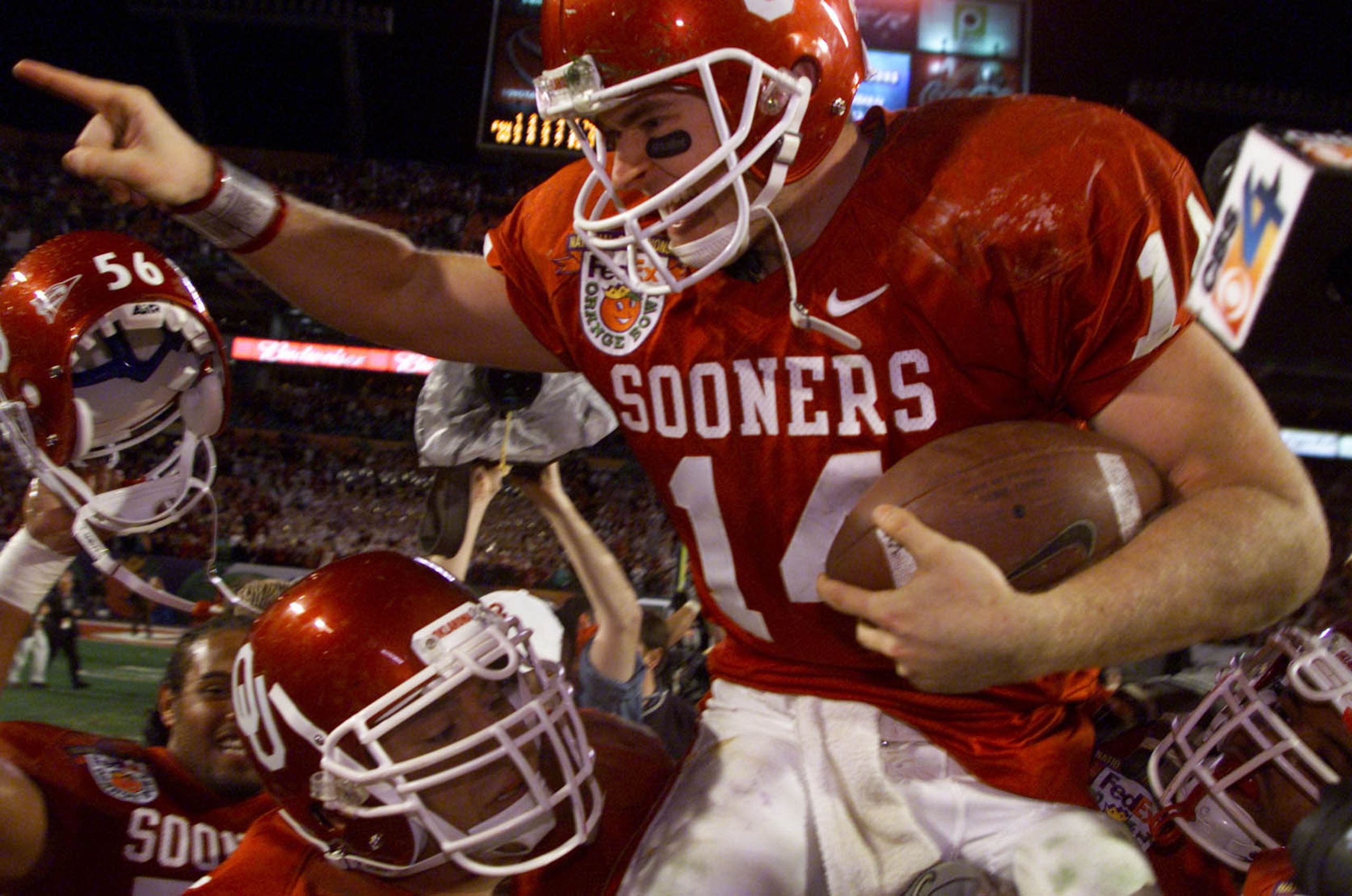 3 Jan 2001:  Quarterback Josh Heupel #14 of the Oklahoma Sooners is hoisted by his teammates after defeating the Florida State Seminoles 13-2 in the Orange Bowl at Pro Player Stadium in Miami, Florida. DIGITAL IMAGE Mandatory Credit: Brian Bahr/ALLSPORT