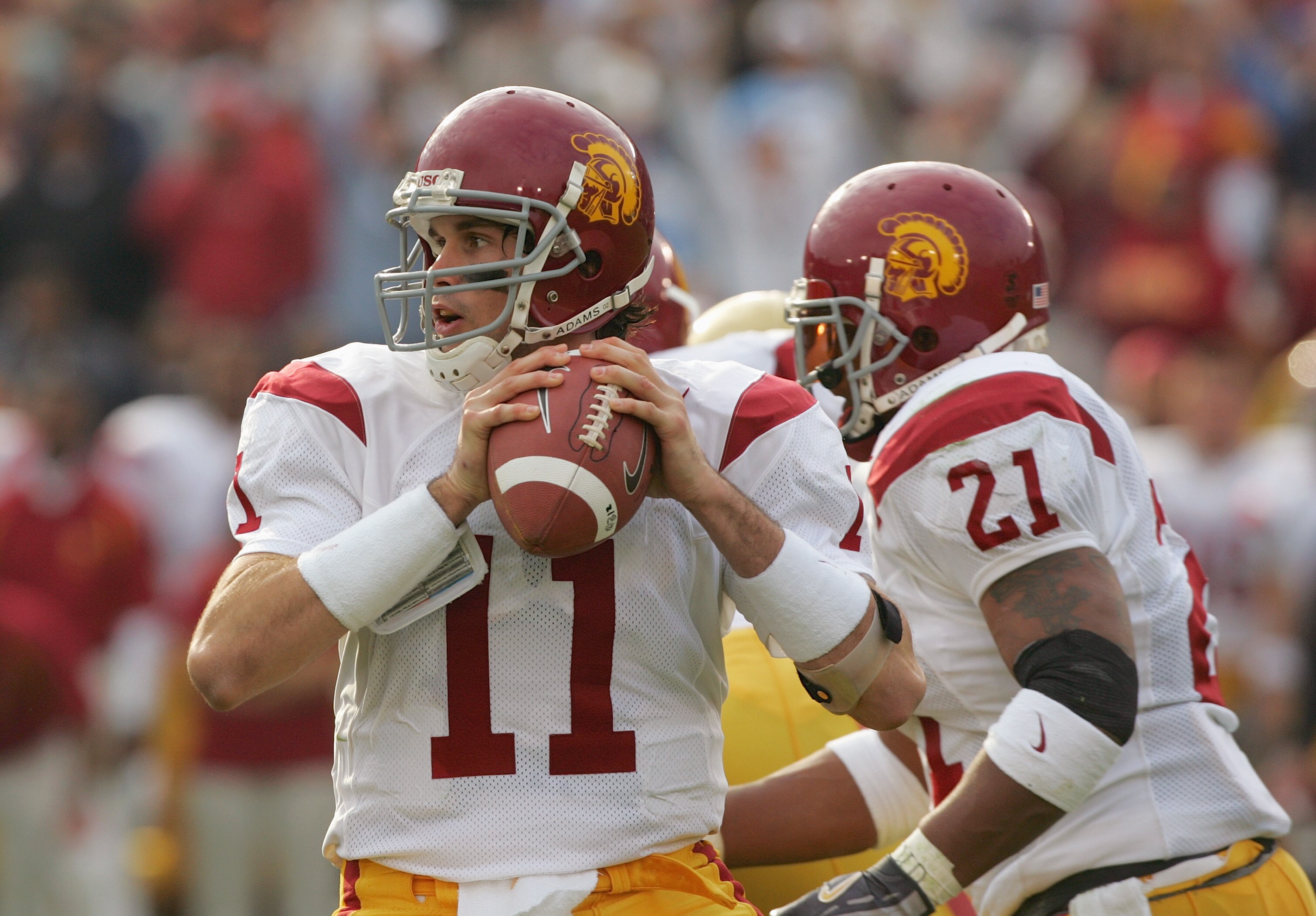 PASADENA, CA - DECEMBER 4:  Matt Leinart #11 of the USC Trojans sets to pass during the game against the UCLA Bruins on December 4, 2004 at the Rose Bowl in Pasadena, California.  USC won 29-24. (Photo by Harry How/Getty Images)