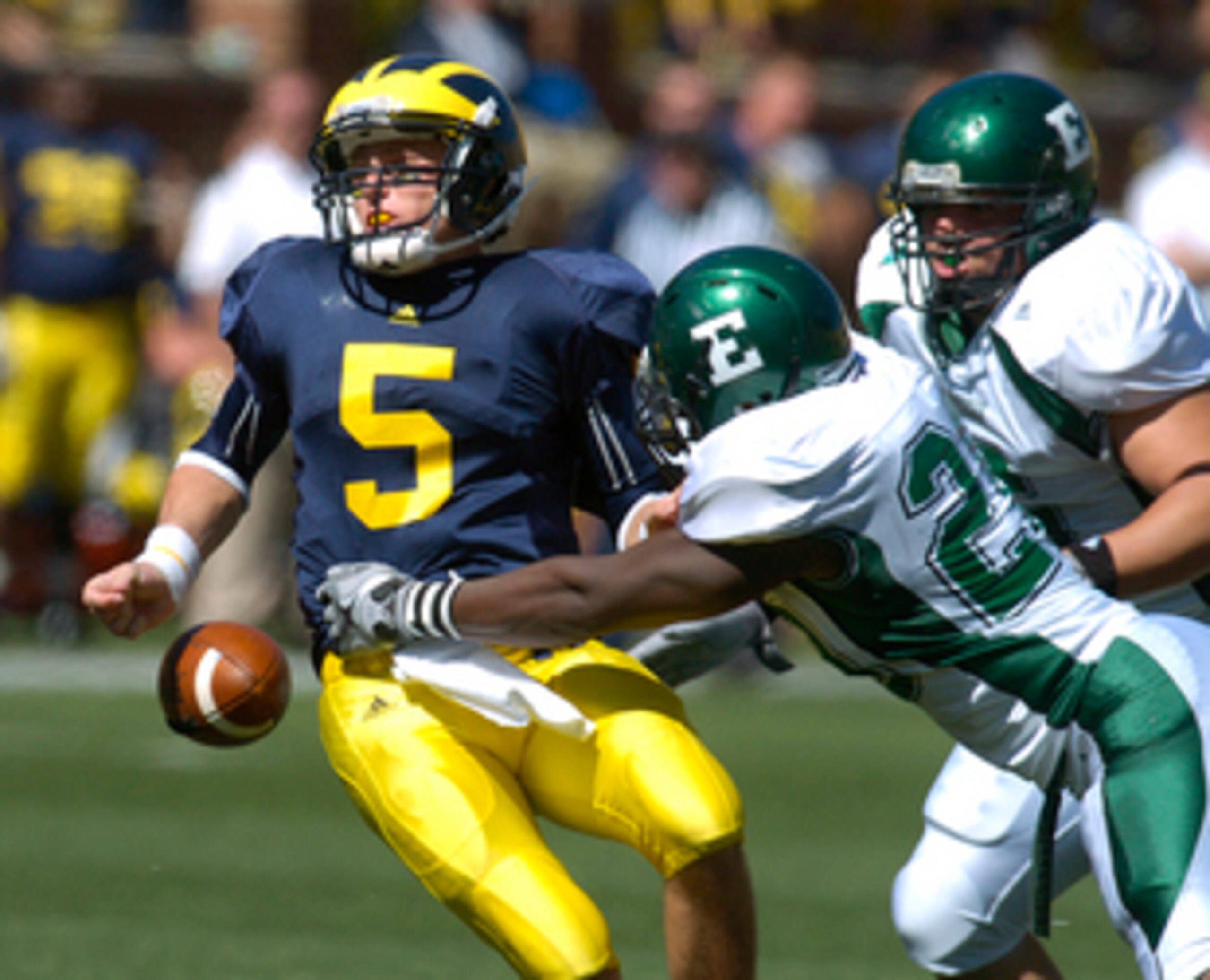 Tate Forcier fumbles the ball against Eastern Michigan last year.