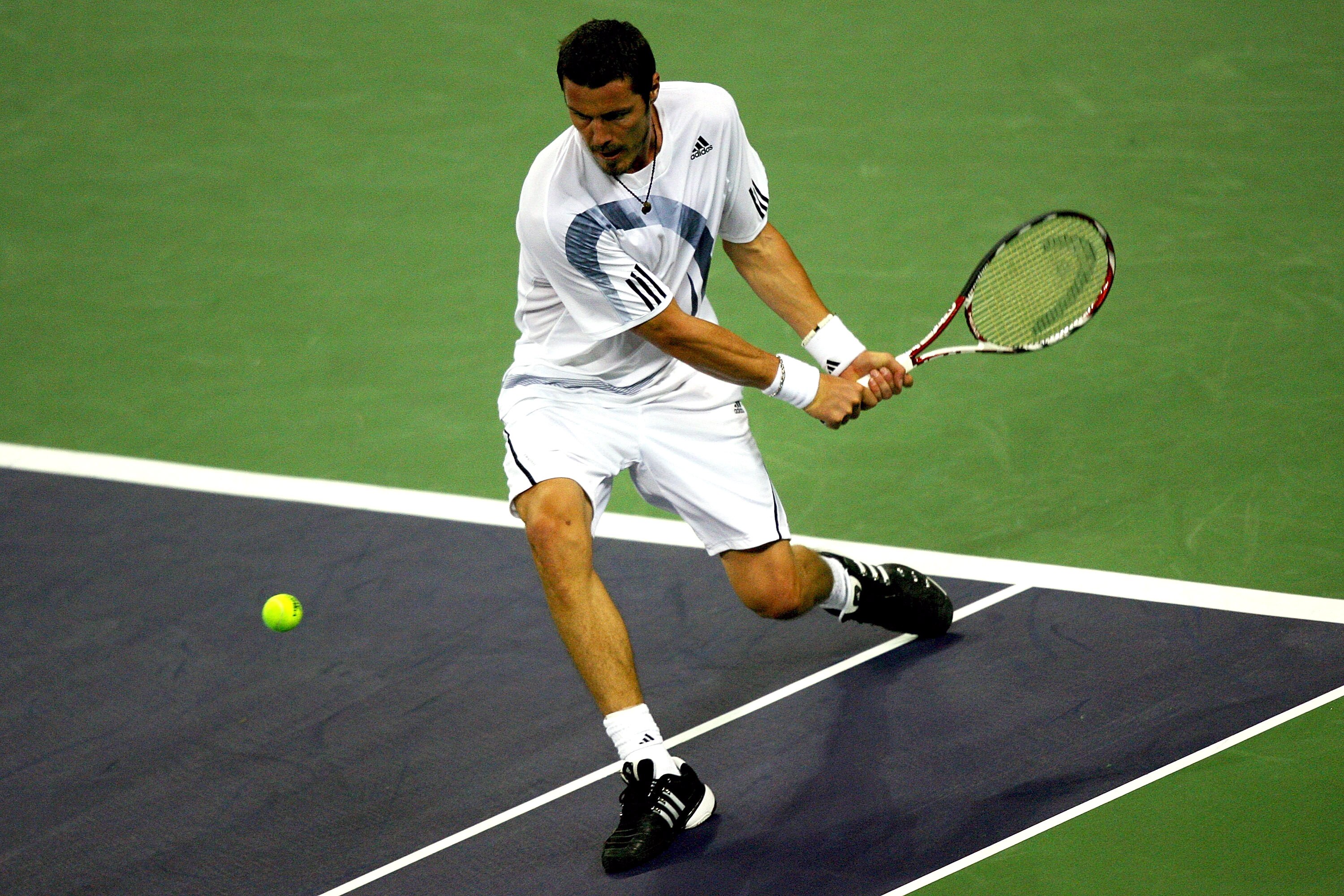 SHANGHAI, CHINA - OCTOBER 12:  Marat Safin of Russia returns a shot to Mao-Xin Gong of China during day two of the 2009 Shanghai ATP Masters 1000 at Qi Zhong Tennis Centre on October 12, 2009 in Shanghai, China.  (Photo by Matthew Stockman/Getty Images)