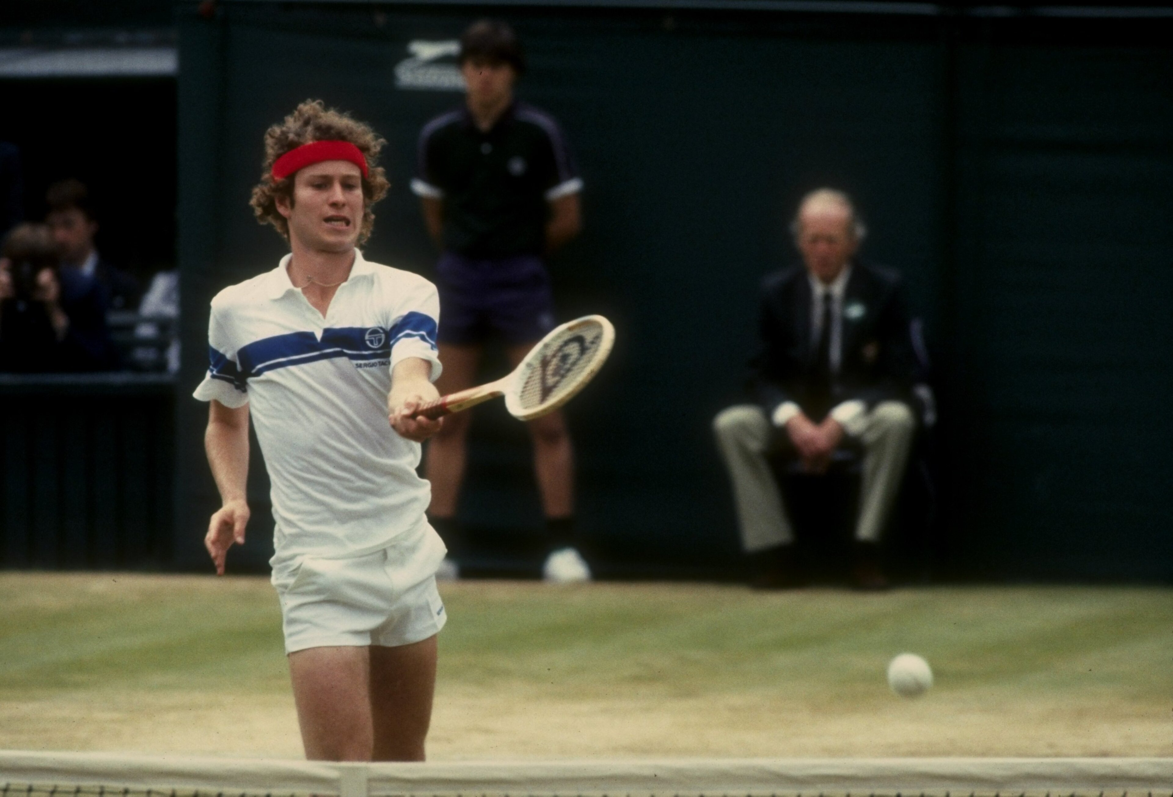 Jul 1981:  John McEnroe of the USA returns a shot during his match against Bjorn Borg in the finals of the 1981 Lawn Tennis Championships at the All-England Club in Wimbledon, England.  McEnroe won the match 4-6, 7-6, 7-6, 6-4. Mandatory Credit: Tony Duff