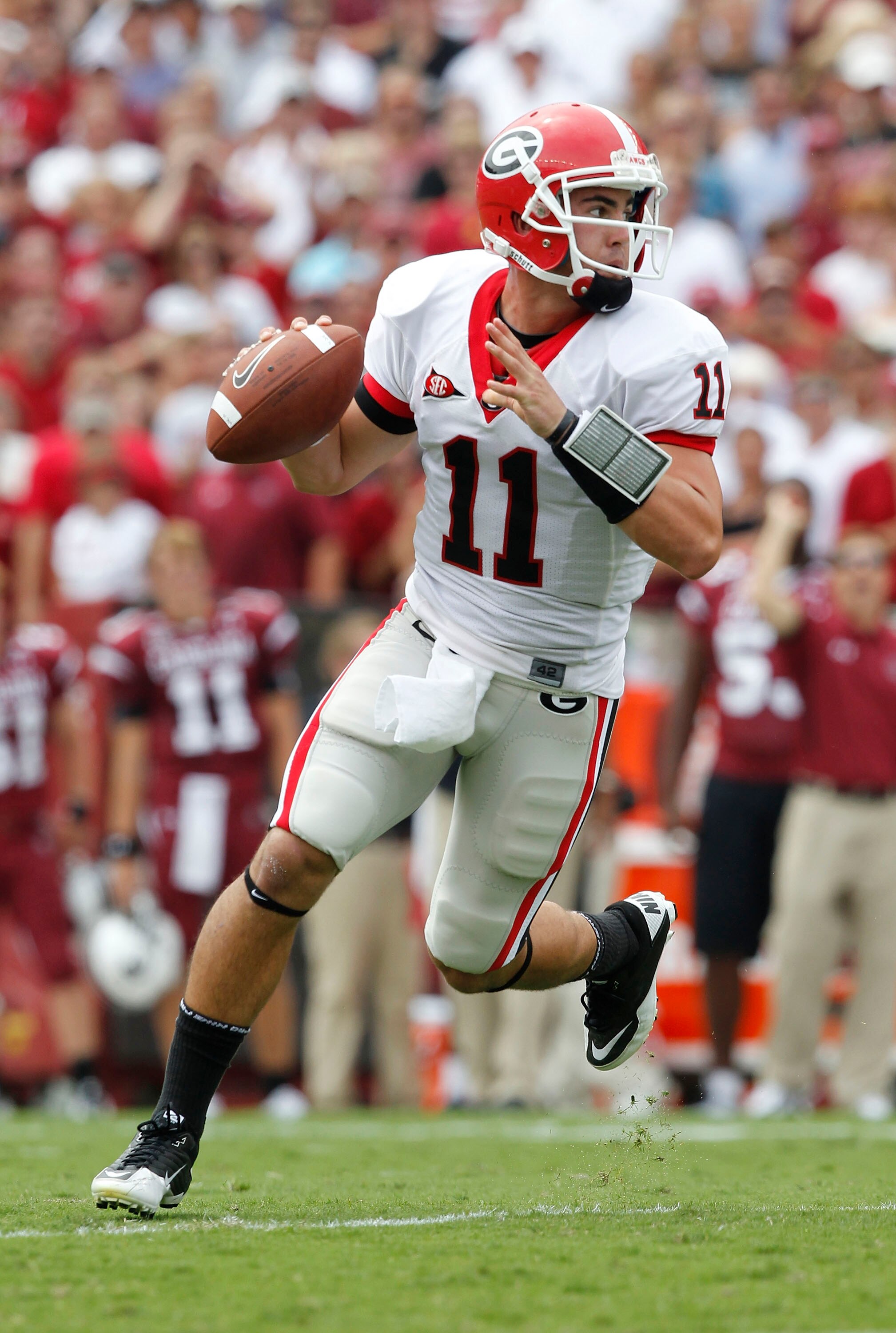 COLUMBIA, SC - SEPTEMBER 11: Quarterback Aaron Murray #11 of the Georgia Bulldogs rolls out and looks downfield to pass during the game against the South Carolina Gamecocks at Williams-Brice Stadium on September 11, 2010 in Columbia, South Carolina. The G