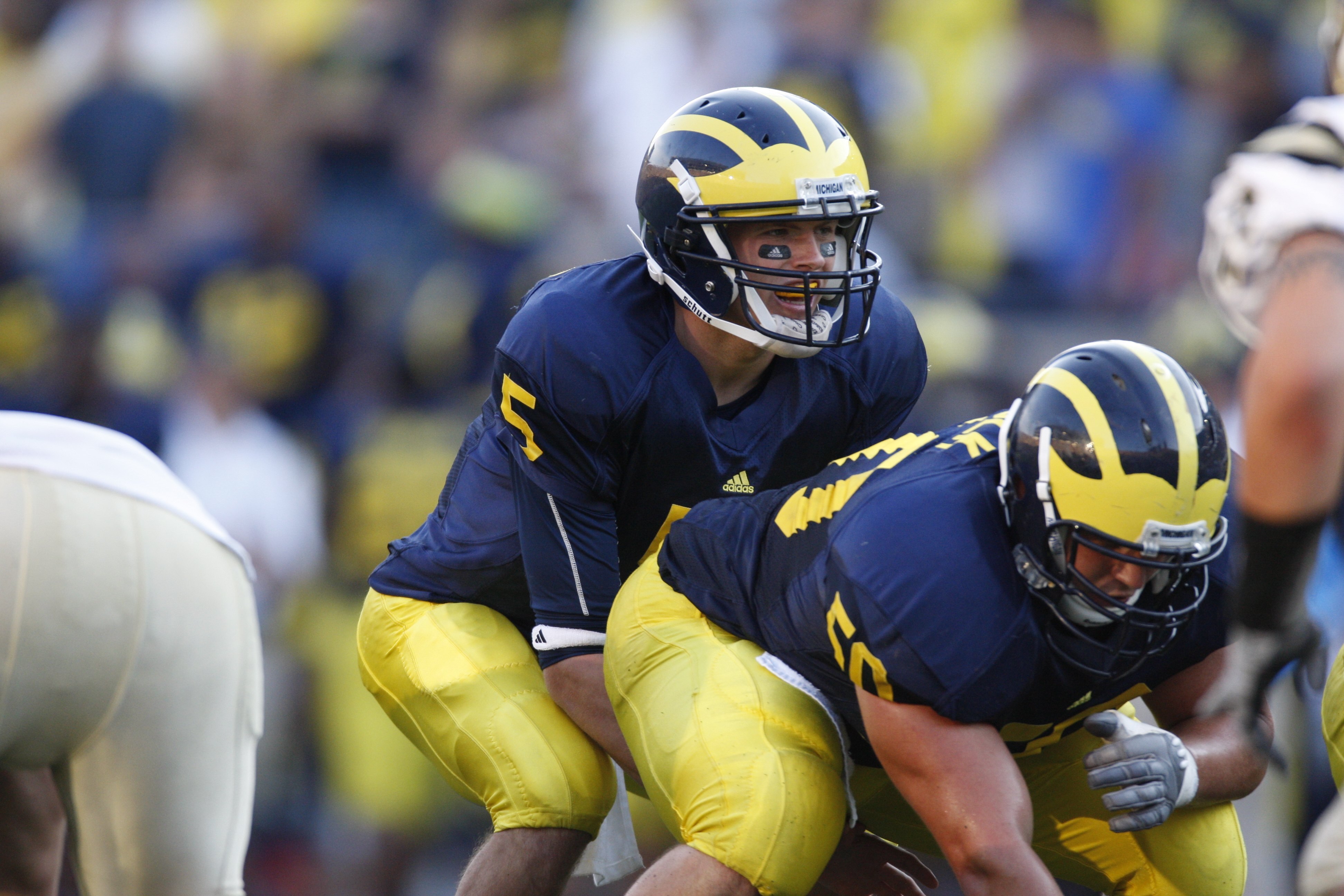 ANN ARBOR, MI - SEPTEMBER 5: Tate Forcier #5 of the Michigan Wolverines stands under center David Molk #50 during the game against the Western Michigan Broncos on September 5, 2009 at Michigan Stadium in Ann Arbor, Michigan. (Photo by Gregory Shamus/Gett ANN ARBOR, MI - SEPTEMBER 5: Tate Forcier #5 of the Michigan Wolverines stands under center David Molk #50 during the game against the Western Michigan Broncos on September 5, 2009 at Michigan Stadium in Ann Arbor, Michigan. (Photo by Gregory Shamus/Gett