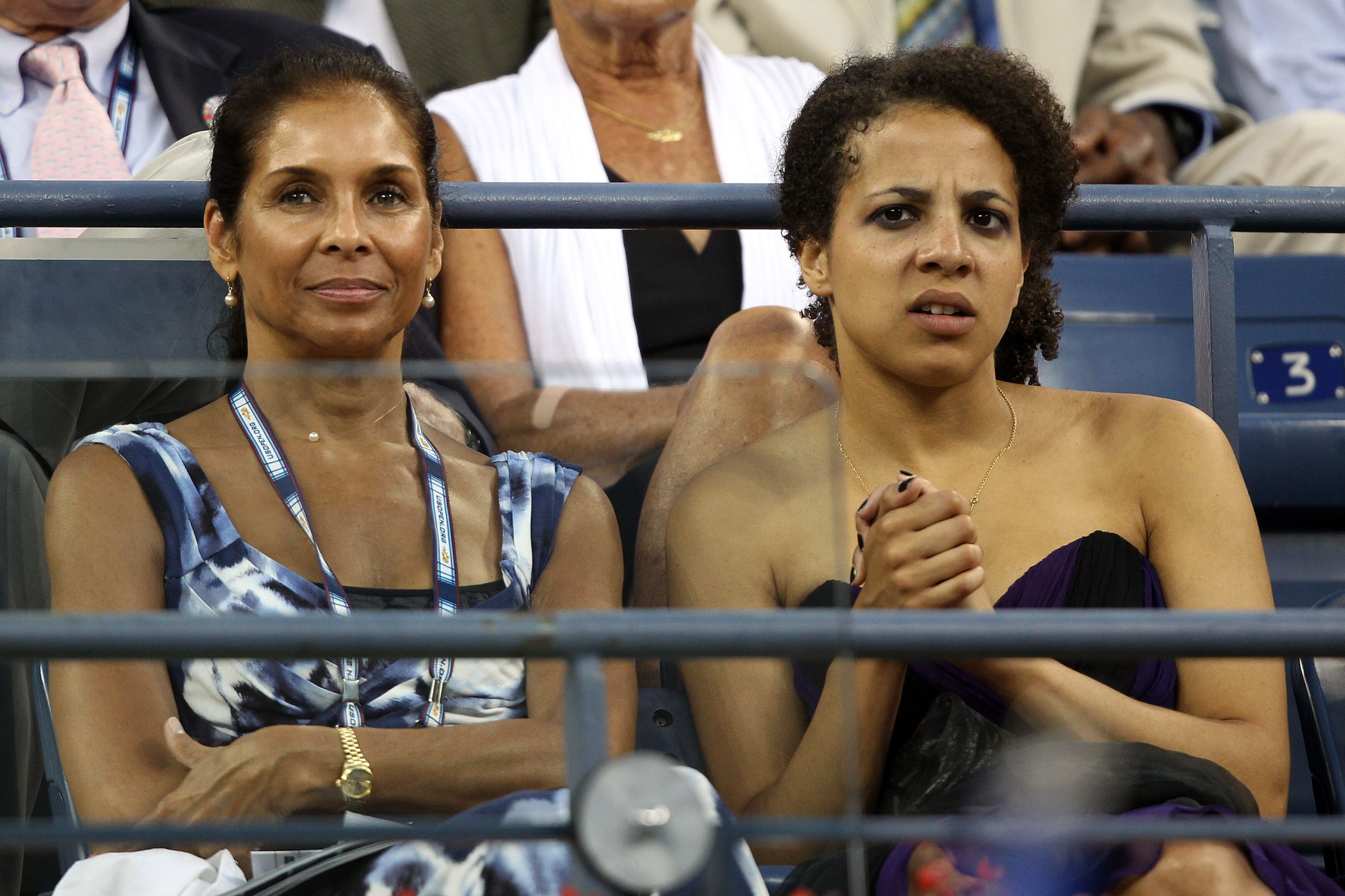 NEW YORK - AUGUST 30: Jeanne Ashe (L), wife of the late Arthur Ashe, and daughter Camera (R) watch the opening ceremony day one of the 2010 U.S. Open at the USTA Billie Jean King National Tennis Center on August 30, 2010 in the Flushing neighborhood of th