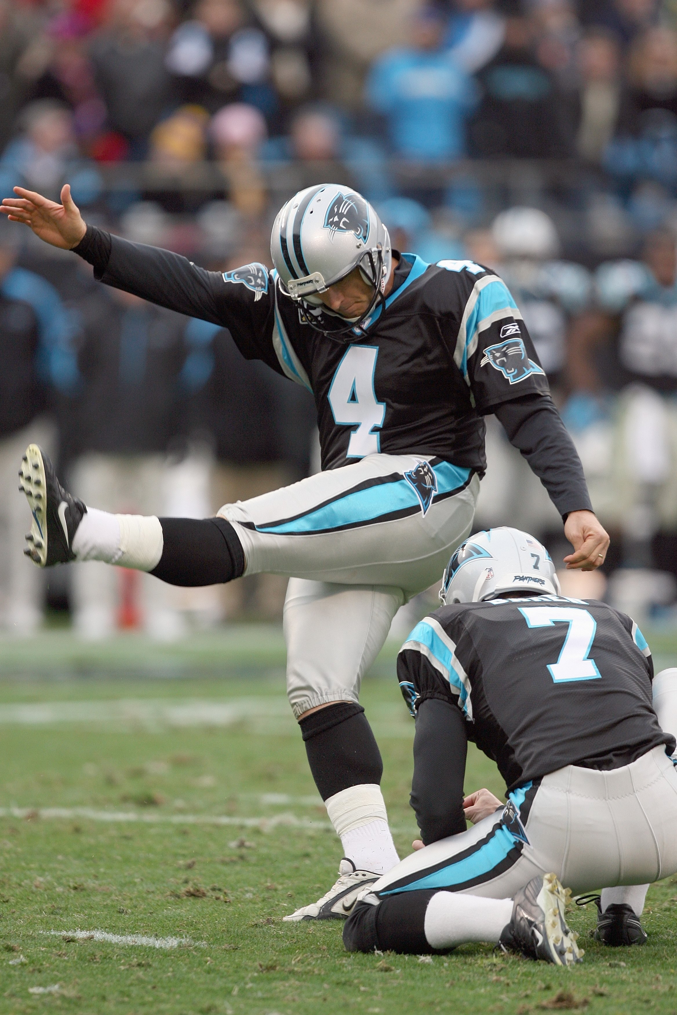 CHARLOTTE, NC - DECEMBER 06:  John Kasay #4 of the Carolina Panthers kicks a field goal during the game against the Tampa Bay Buccaneers at Bank of America Stadium on December 6, 2009 in Charlotte, North Carolina.  (Photo by Streeter Lecka/Getty Images)