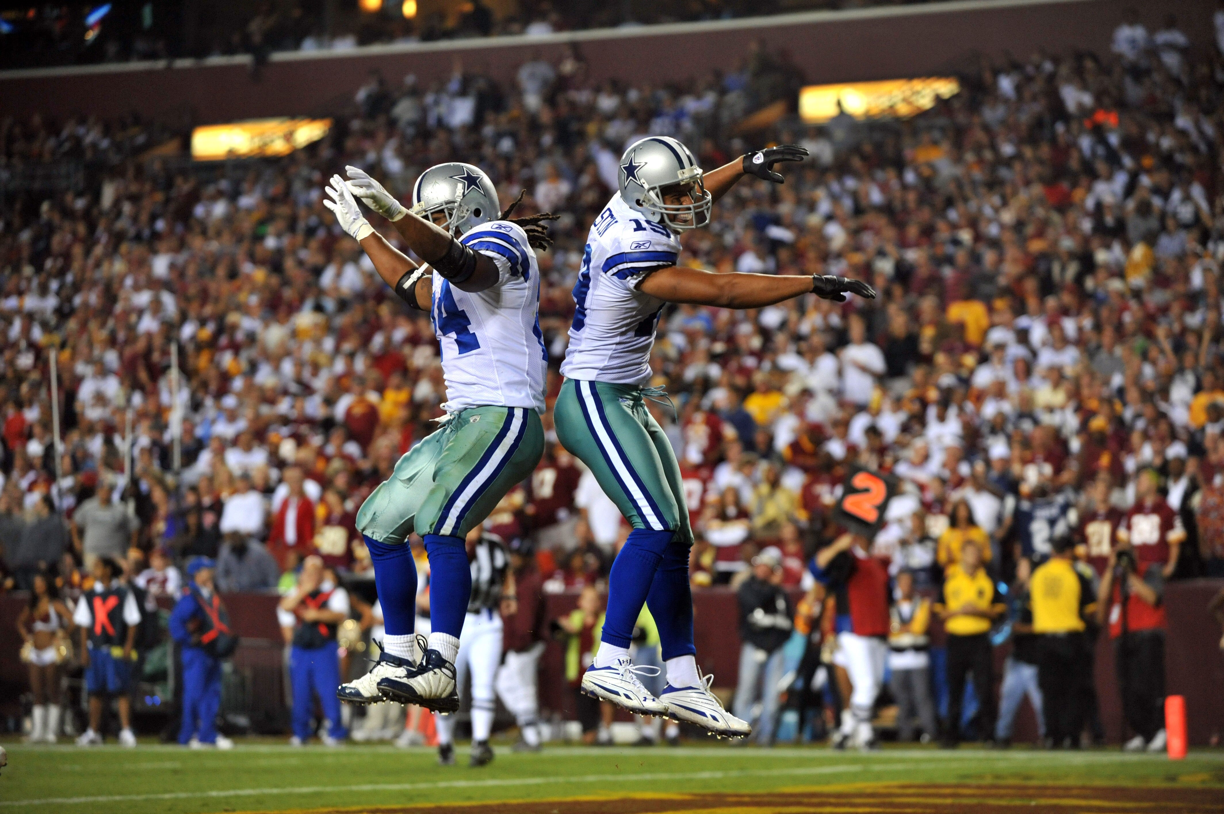 LANDOVER - SEPTEMBER 12:  Miles Austin #19 of the Dallas Cowboys celebrates his touchdown during the NFL season opener against the Washington Redskins at FedExField on September 12, 2010 in Landover, Maryland. The Redskins defeated the Cowboys 13-7. (Phot