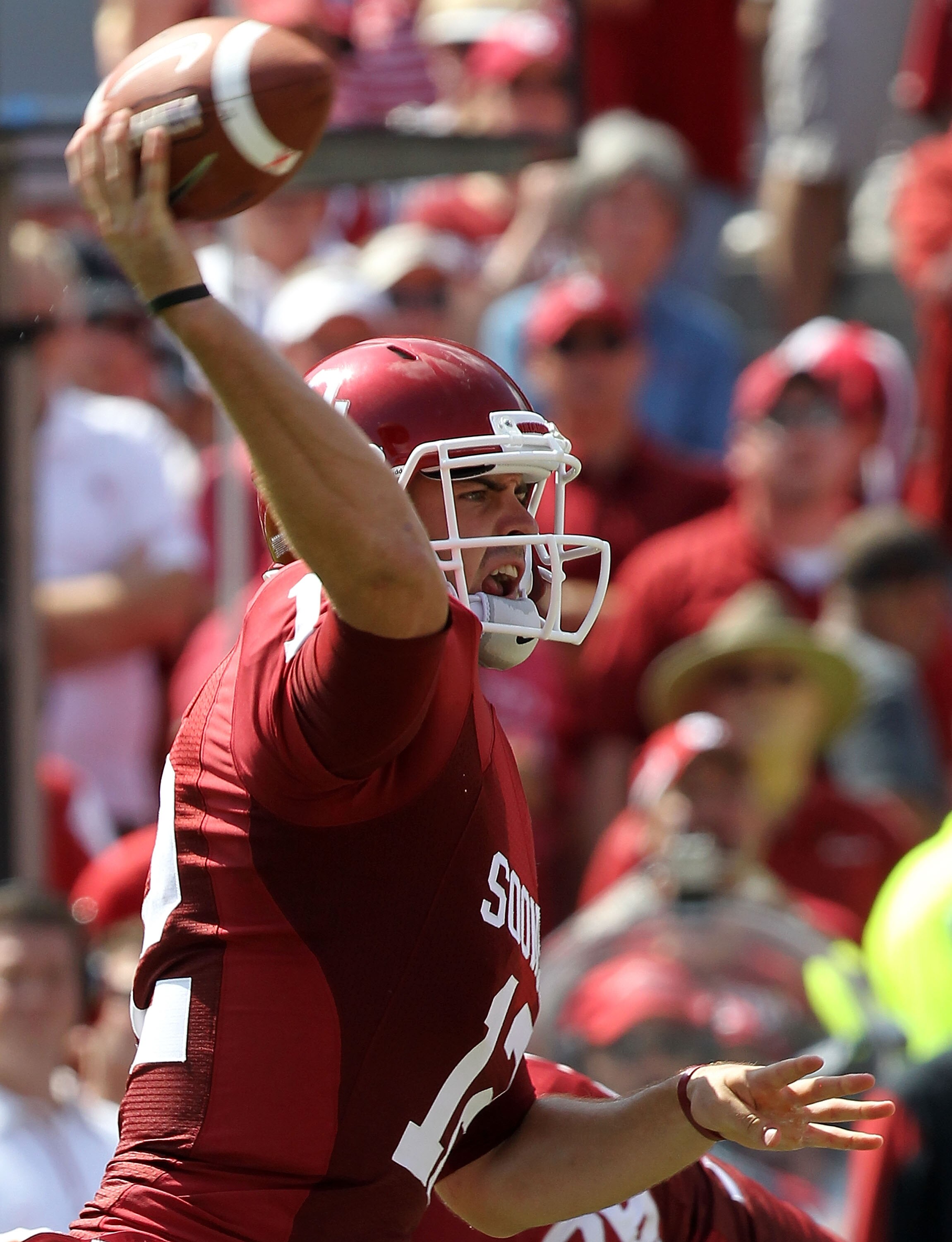 NORMAN, OK - SEPTEMBER 11:  Quarterback Landry Jones #12 of the Oklahoma Sooners drops back to pass against the Florida State Seminoles in the first quarter at Gaylord Family Oklahoma Memorial Stadium on September 11, 2010 in Norman, Oklahoma.  (Photo by