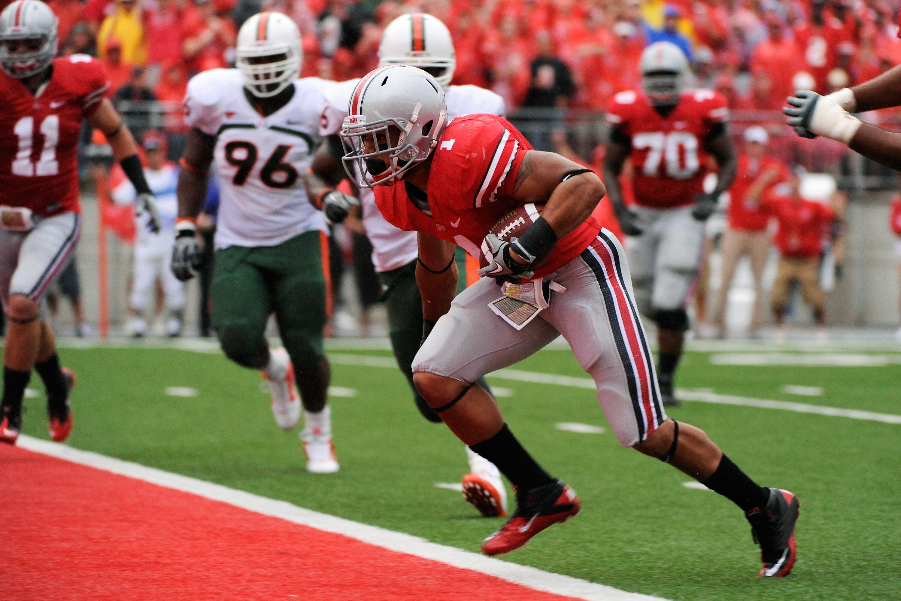 COLUMBUS, OH - SEPTEMBER 11:  Dan Herron #1 of the Ohio State Buckeyes scores a touchdown in the second quarter against the Miami Hurricanes at Ohio Stadium on September 11, 2010 in Columbus, Ohio.  (Photo by Jamie Sabau/Getty Images)
