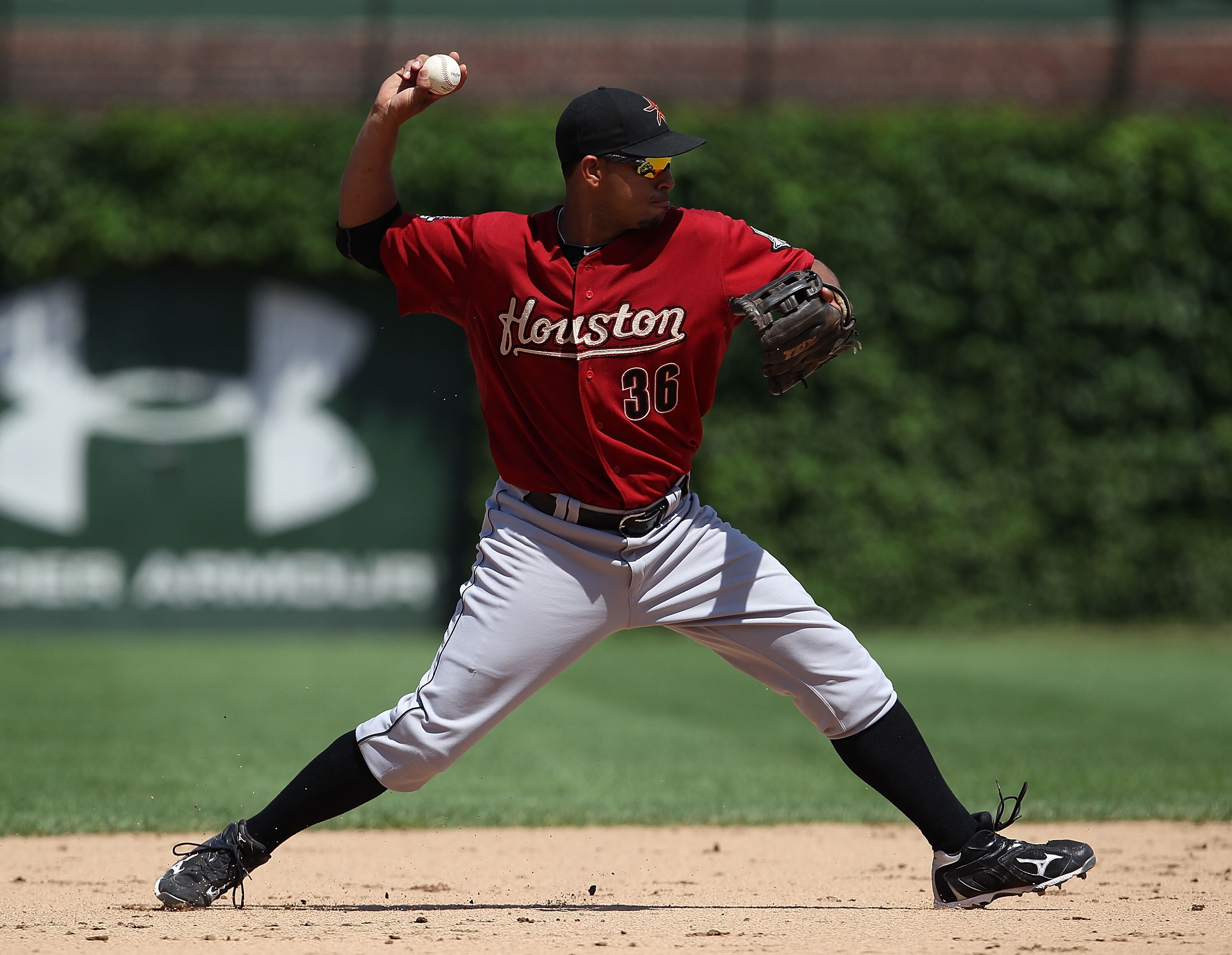 CHICAGO - JULY 21: Angel Sanchez #36 of the Houston Astros throws the ball to 1st base against the Chicago Cubs at Wrigley Field on July 21, 2010 in Chicago, Illinois. The Astros defeated the Cubs 4-3 in 12 innings. (Photo by Jonathan Daniel/Getty Images)
