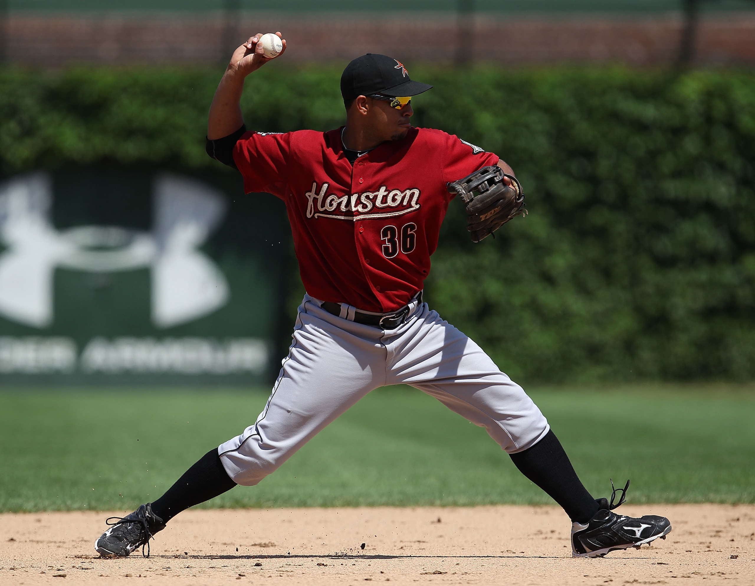 CHICAGO - JULY 21: Angel Sanchez #36 of the Houston Astros throws the ball to 1st base against the Chicago Cubs at Wrigley Field on July 21, 2010 in Chicago, Illinois. The Astros defeated the Cubs 4-3 in 12 innings. (Photo by Jonathan Daniel/Getty Images)