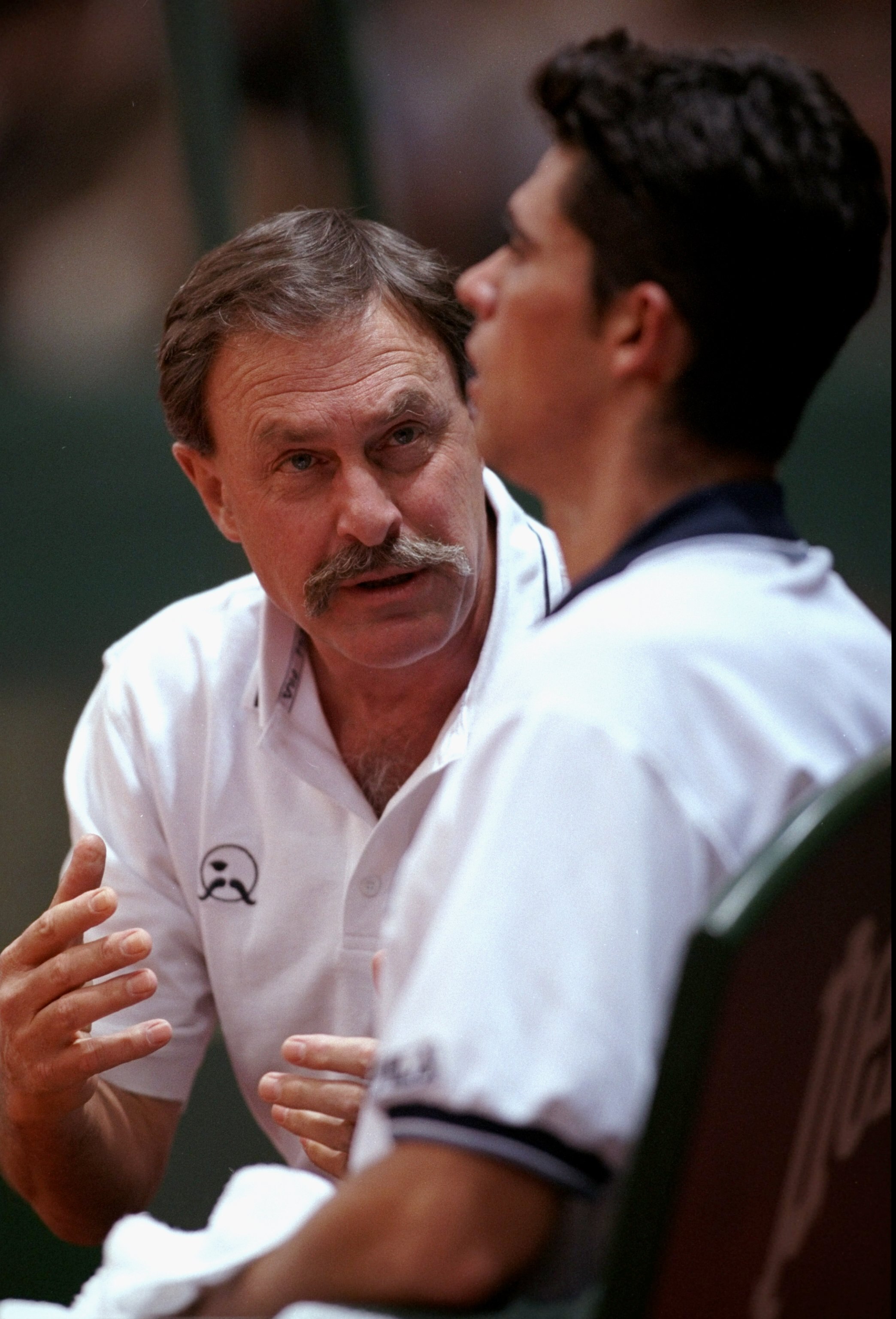 5 Dec 1999:  John Newcombe talks to Mark Philippoussis of Australia during the Davis Cup match against France played in Nice, France. \ Mandatory Credit: Clive Brunskill /Allsport