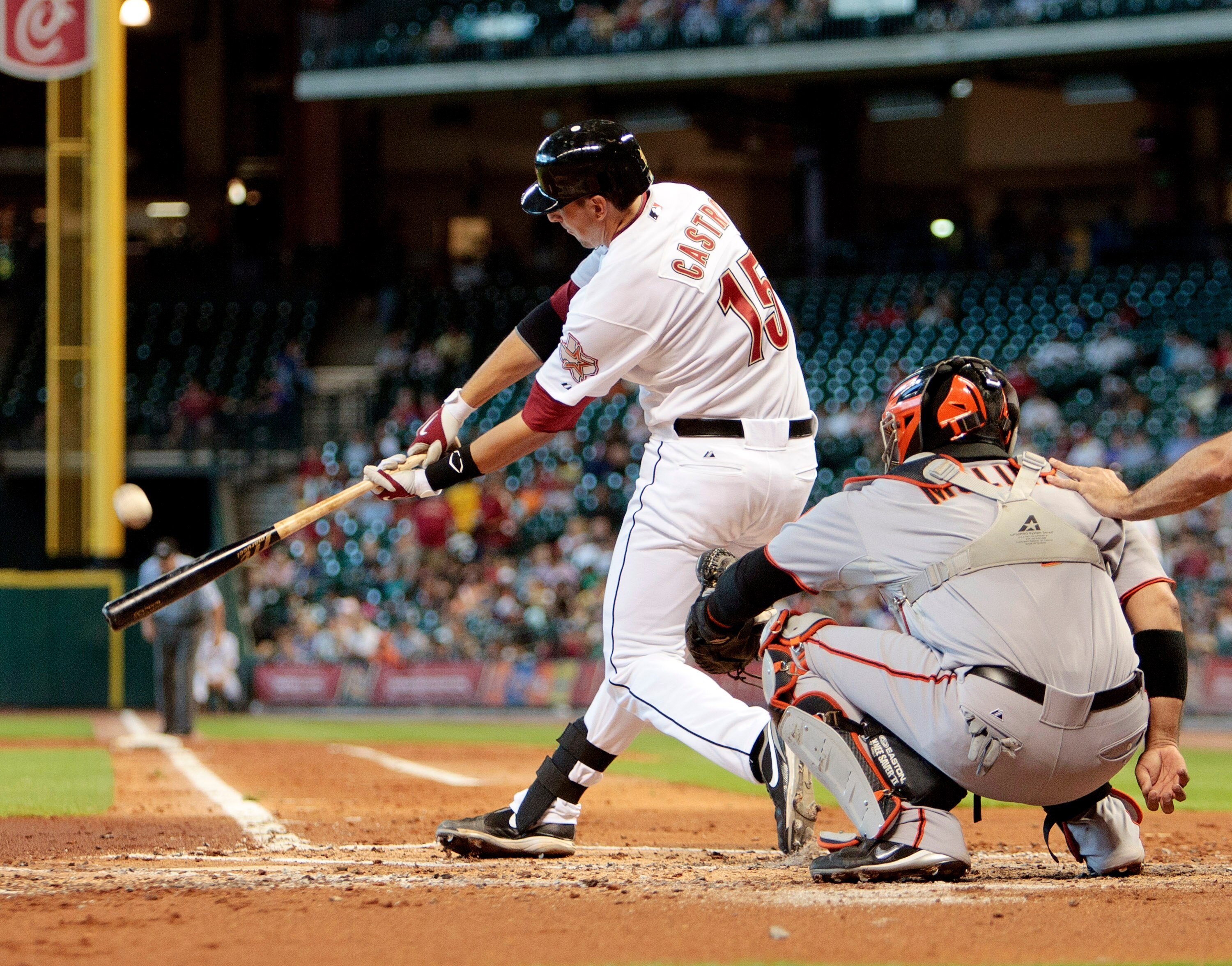 HOUSTON - JUNE 24:  Jason Casto #15 of the Houston Astros hits a home run to right field in the second inning against the San Francisco Giants at Minute Maid Park on June 24, 2010 in Houston, Texas.  (Photo by Bob Levey/Getty Images)