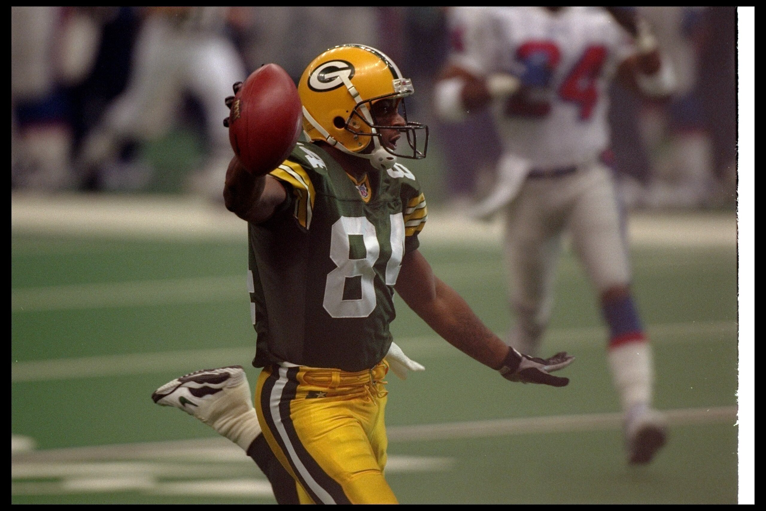 26 Jan 1997: Wide receiver Andre Rison of the Green Bay Packers celebrates after scoring a touchdown during Super Bowl XXXI against the New England Patriots at the Superdome in New Orleans, Louisiana. The Packers won the game, 35-21. Mandatory Credit: B 26 Jan 1997: Wide receiver Andre Rison of the Green Bay Packers celebrates after scoring a touchdown during Super Bowl XXXI against the New England Patriots at the Superdome in New Orleans, Louisiana. The Packers won the game, 35-21. Mandatory Credit: B