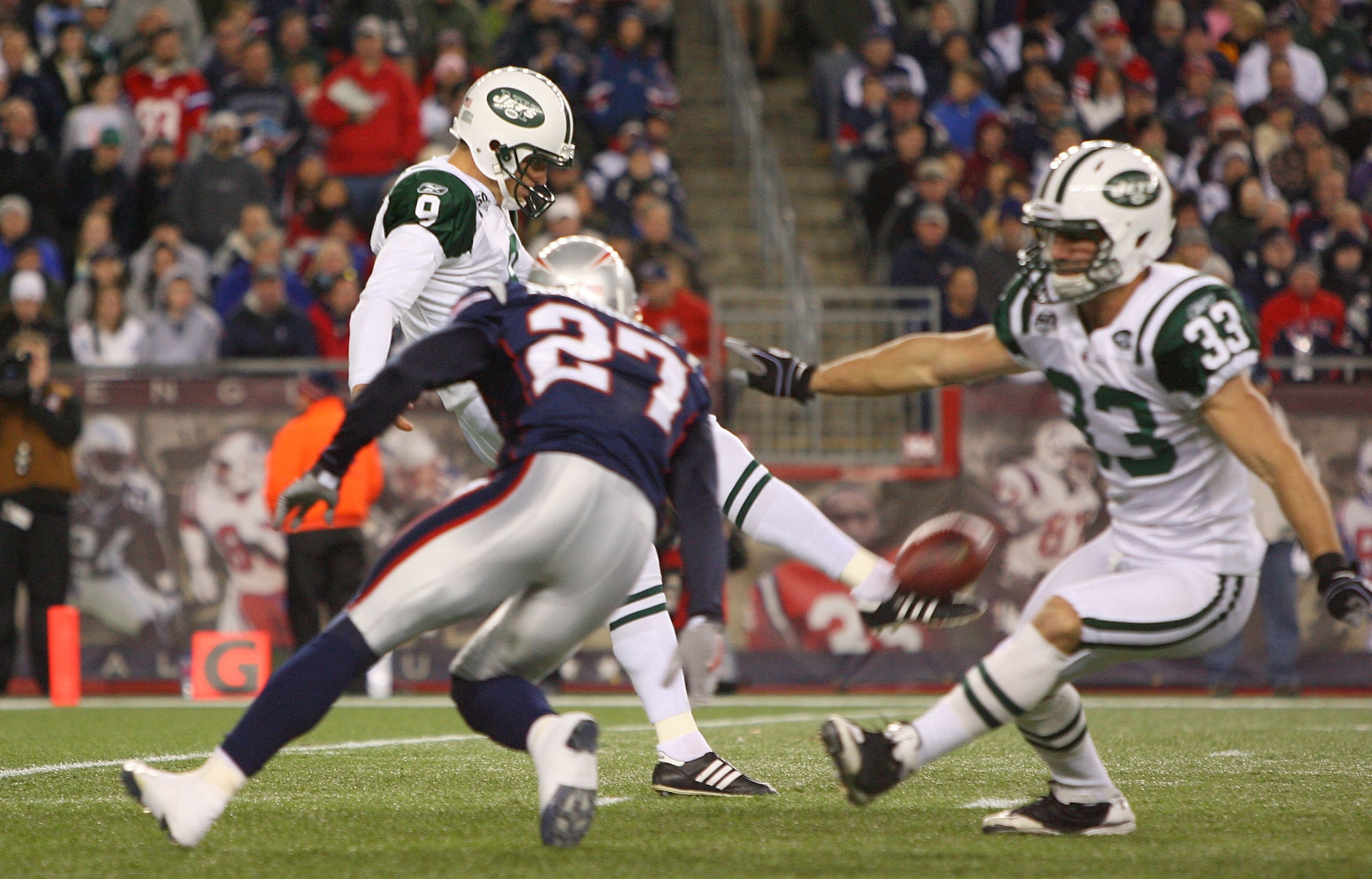 FOXBORO, MA - NOVEMBER 22: Kyle Arrington #27 of the New England Patriots presses punter  Steven Weatherford #9 of the New York Jets during a game against the New York Jets at Gillette Stadium on November 22, 2009 in Foxboro, Massachusetts. (Photo by Jim