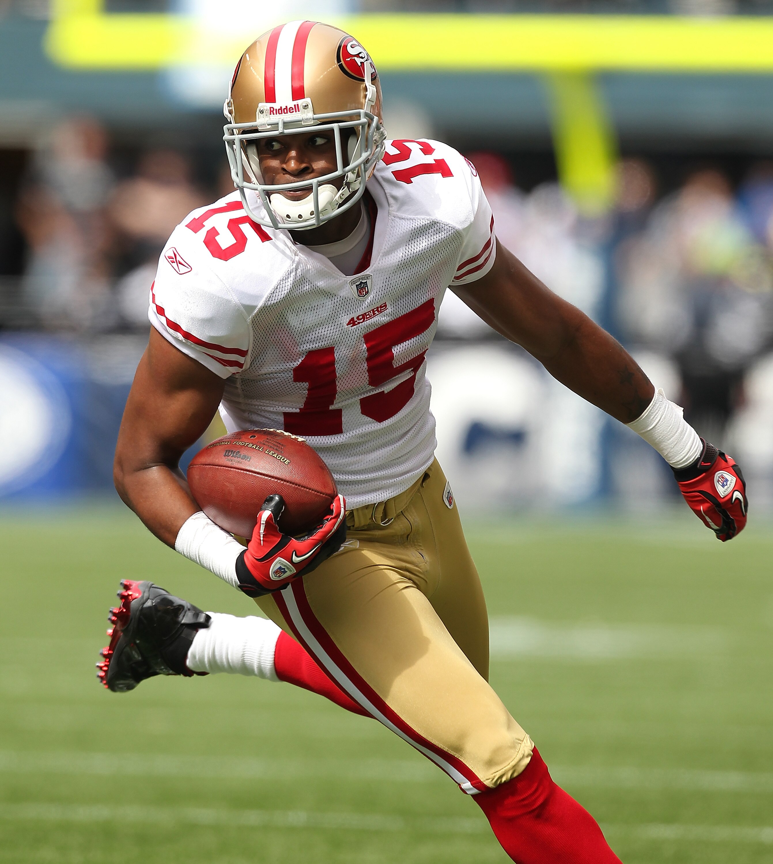 SEATTLE - SEPTEMBER 12:  Wide receiver Michael Crabtree #15 of the San Francisco 49ers rushes during the NFL season opener against the Seattle Seahawks at Qwest Field on September 12, 2010 in Seattle, Washington. (Photo by Otto Greule Jr/Getty Images)