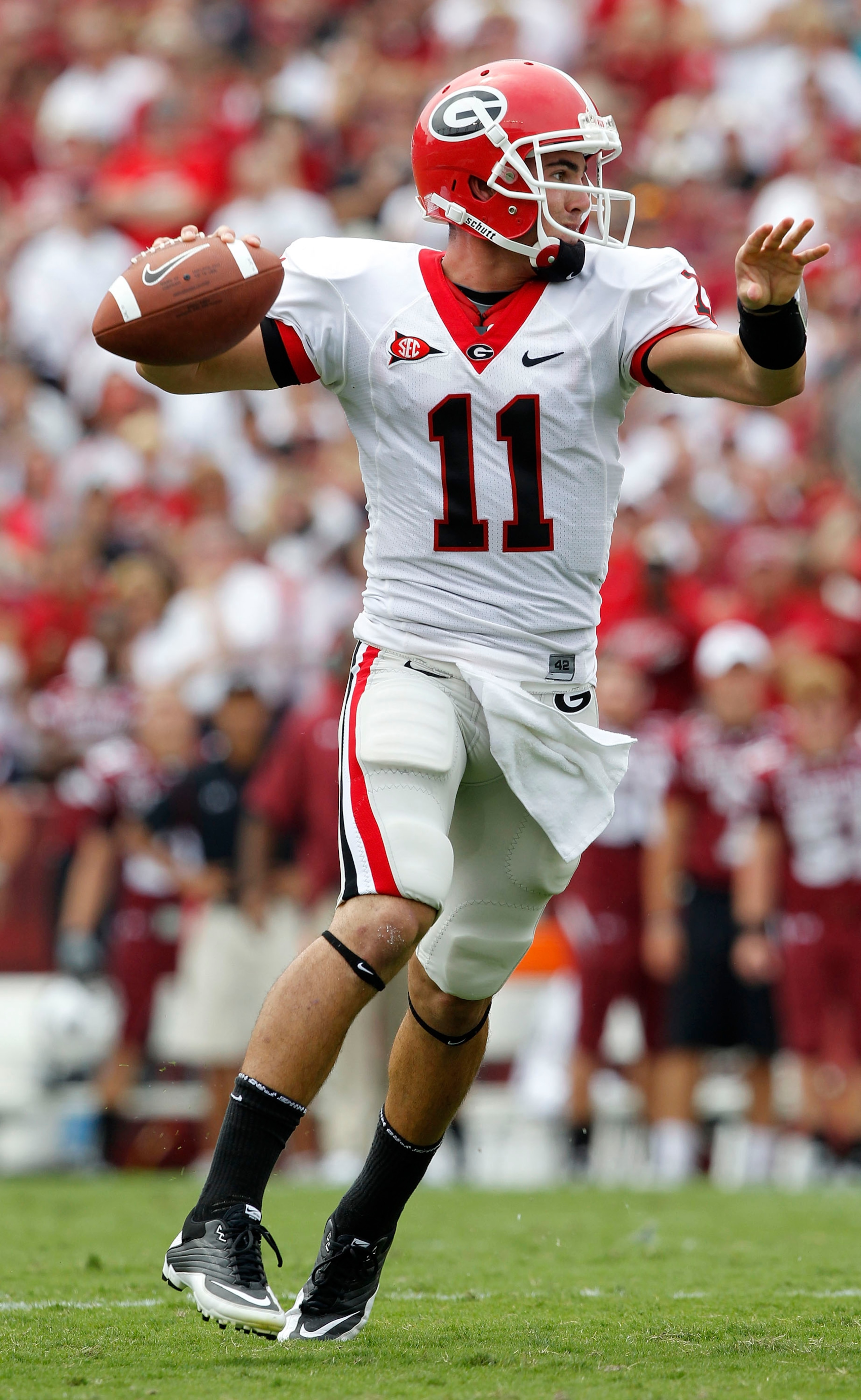 COLUMBIA, SC - SEPTEMBER 11: Quarterback Aaron Murray #11 of the Georgia Bulldogs rolls out and looks downfield to pass during the game against the South Carolina Gamecocks at Williams-Brice Stadium on September 11, 2010 in Columbia, South Carolina. The G