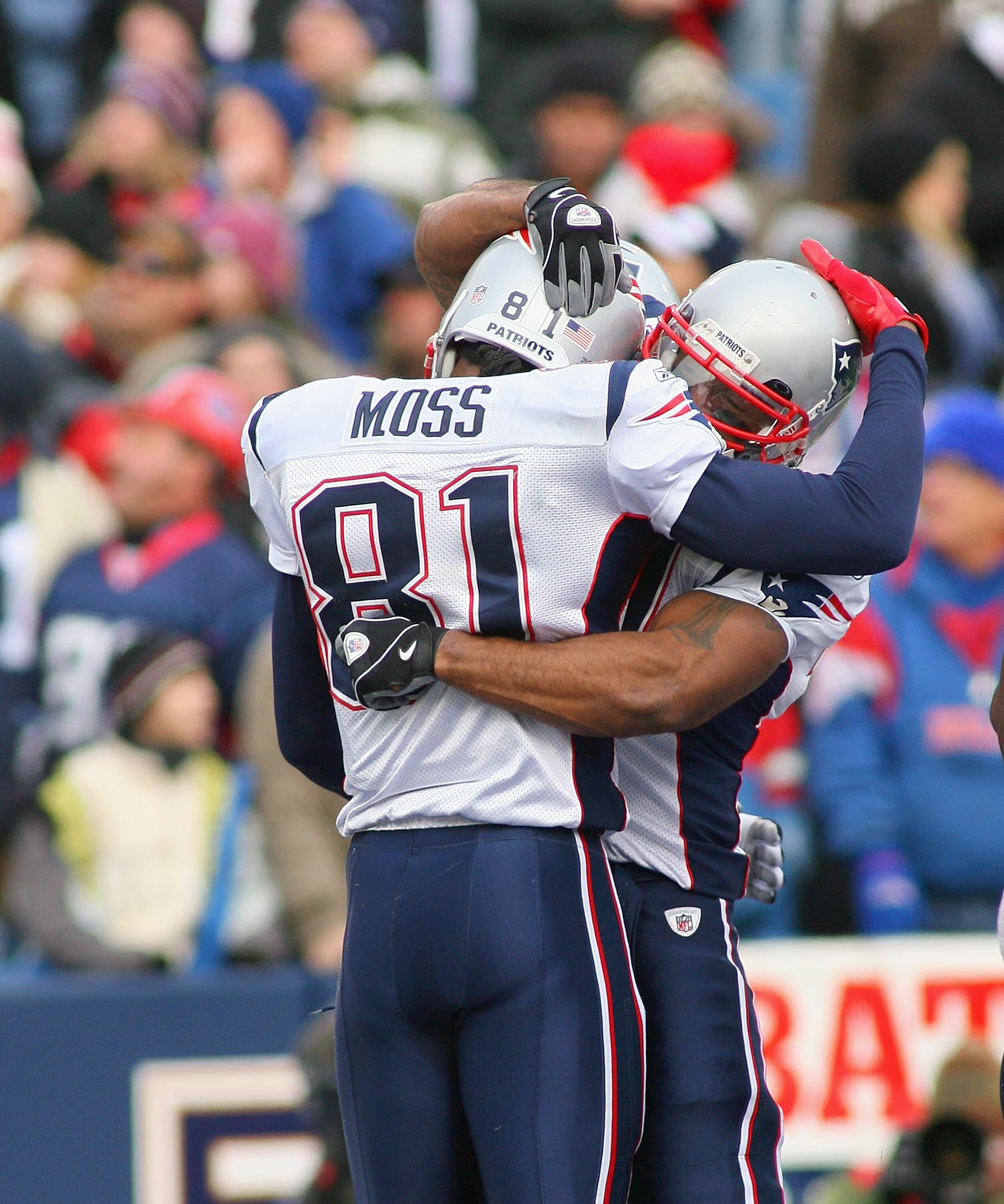 ORCHARD PARK, NY - DECEMBER 20: Randy Moss #81 and Sammy Morris #34 of the New England Patriots celebrate Moss's touchdown in the second quarter against the Buffalo Bills  at Ralph Wilson Stadium on December 20, 2009 in Orchard Park, New York.  (Photo by 