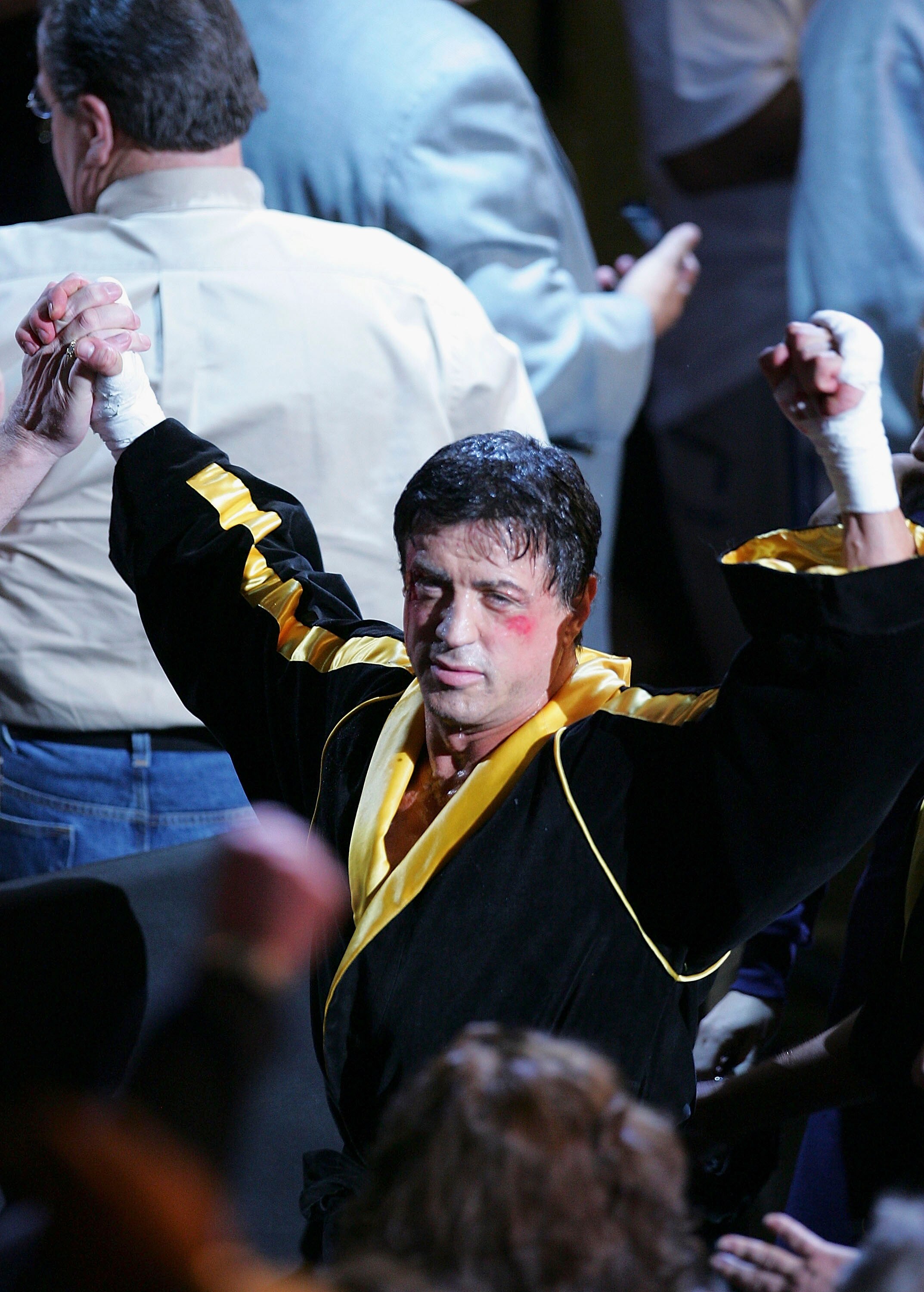 LAS VEGAS - DECEMBER 03:  Actor Sylvester Stallone waves to the crowd as scenes from the film 'Rocky VI' are filmed before the start of the Bernard Hopkins and Jermain Taylor fight at the Mandalay Bay Events Center on December 3, 2005 in Las Vegas, Nevada