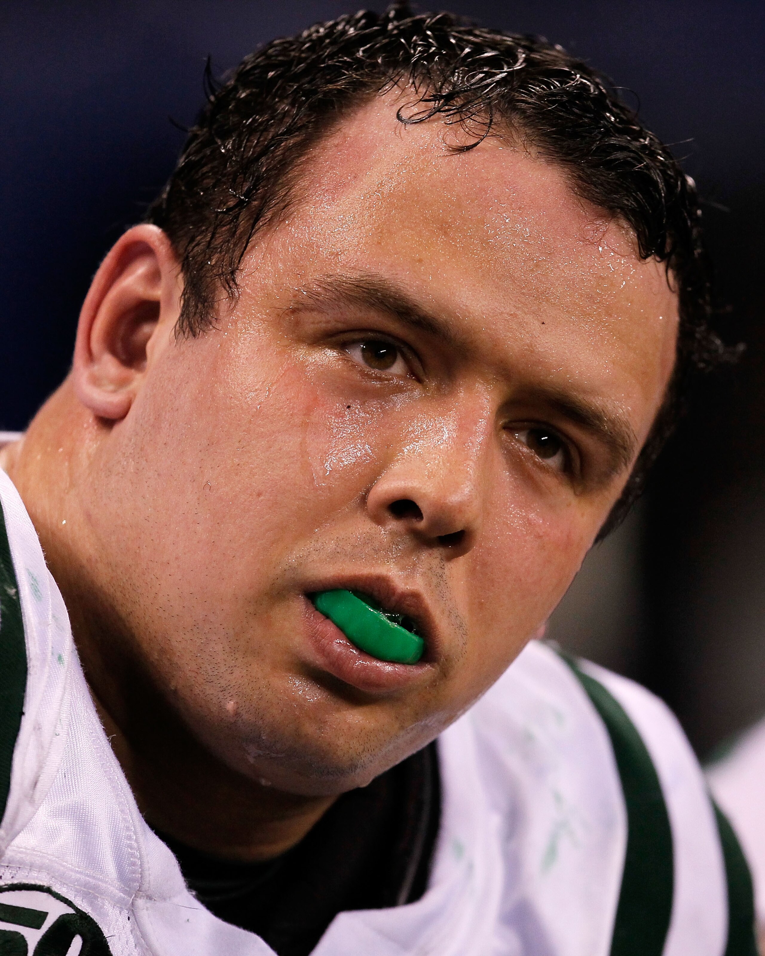 INDIANAPOLIS - JANUARY 24:  Defensive end Mike Devito #70 of the New York Jets looks on from the sidelines during the fourth quarter of the game against the Indianapolis Colts during the AFC Championship Game at Lucas Oil Stadium on January 24, 2010 in In