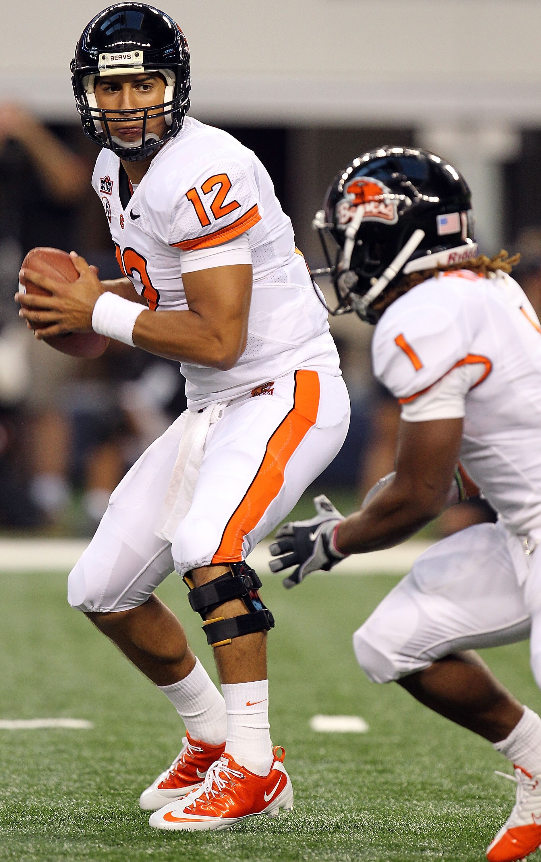 ARLINGTON, TX - SEPTEMBER 04:  Quarterback Ryan Katz #12 of the Oregon State Beavers drops back to pass against the TCU Horned Frogs at Cowboys Stadium on September 4, 2010 in Arlington, Texas.  (Photo by Ronald Martinez/Getty Images)