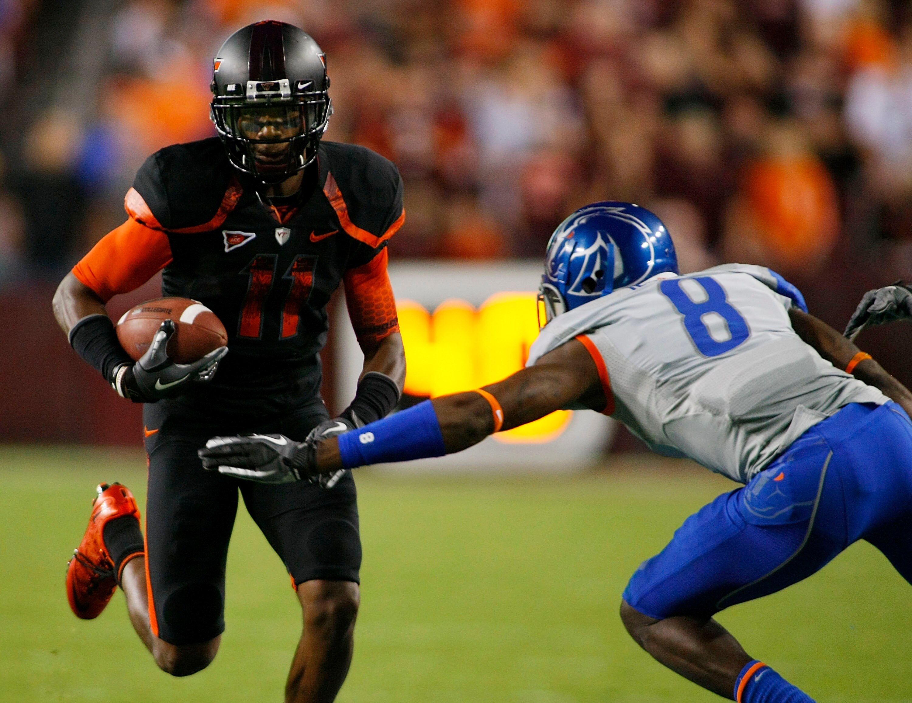 LANDOVER, MD - SEPTEMBER 06: Wide reciever Dyrell Roberts #11 of the Virginia Tech Hokies runs with the ball as safety George Iloka #8 of the Boise State Broncos defends at FedExField on September 6, 2010 in Landover, Maryland.  (Photo by Geoff Burke/Gett