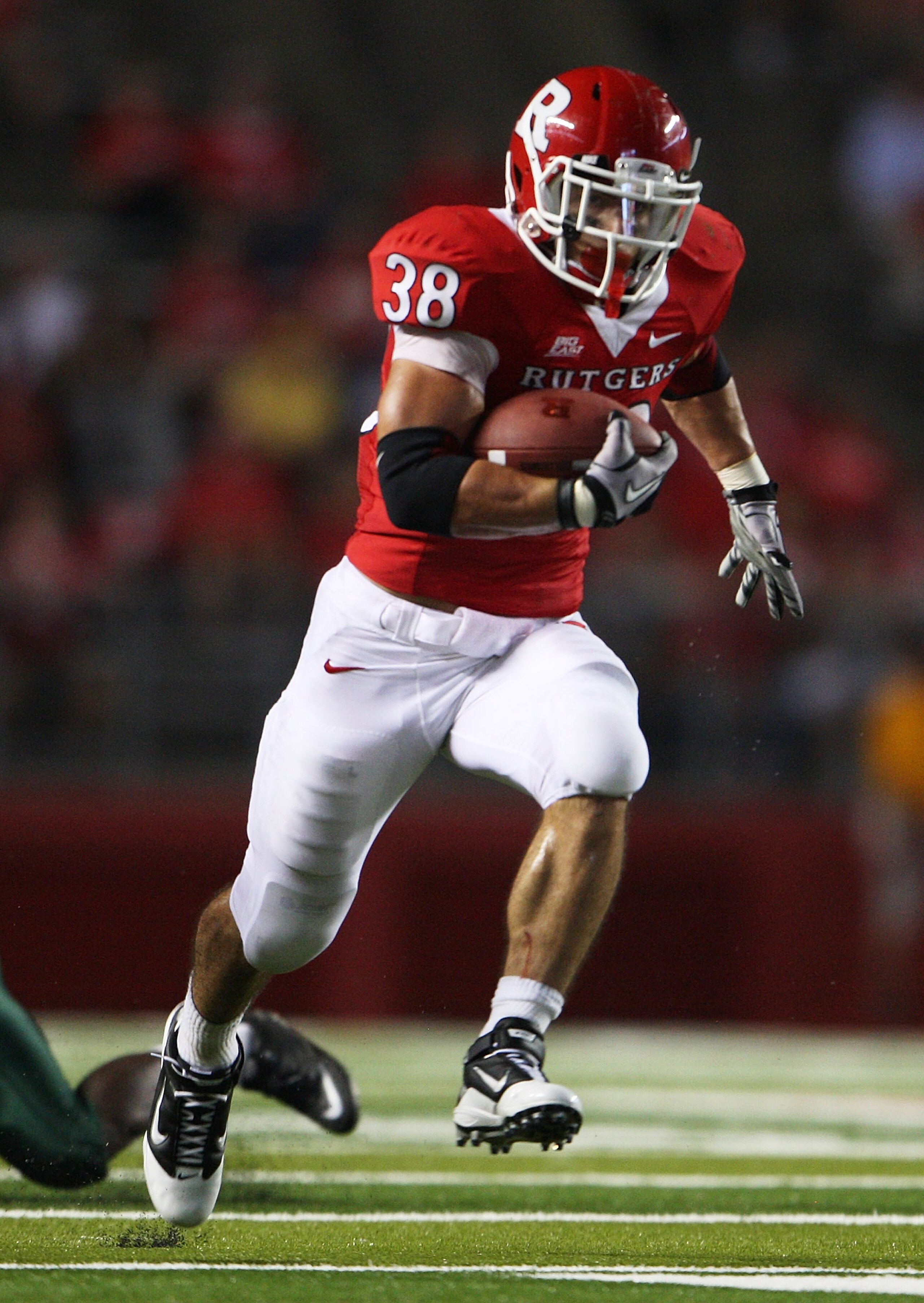 NEW BRUNSWICK, NJ - SEPTEMBER 02:  Joe Martinek #38 of the Rutgers Scarlet Knights runs the ball against the Norfolk State Spartans at Rutgers Stadium on September 2, 2010 in New Brunswick, New Jersey. The Scarlet Knights beat the Spartans 31 - 0.  (Photo