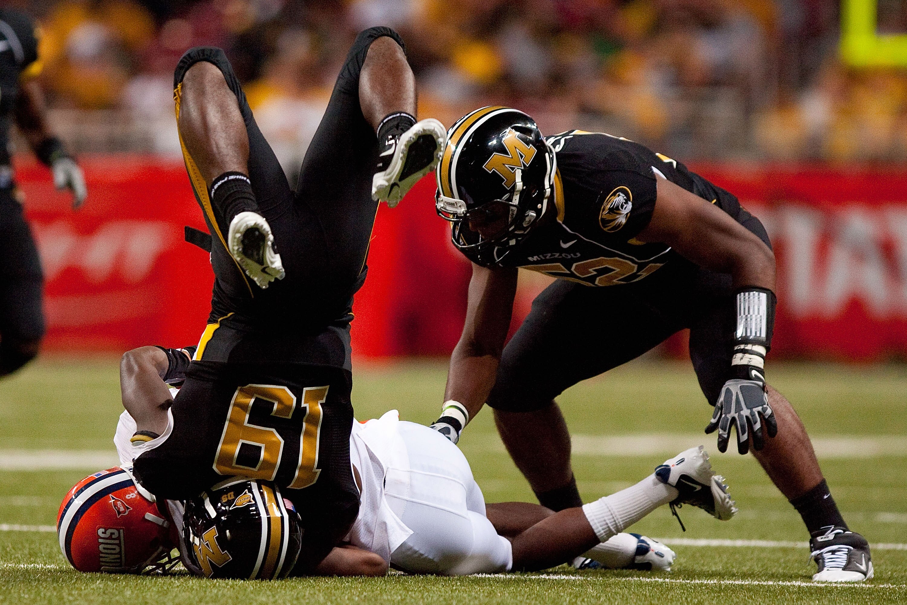 ST. LOUIS - SEPTEMBER 4: A.J. Jenkins #8 of the University of Missouri Tigers is tackled by Jack Ramsey #19 of the University of Illinois Fighting Illini during the State Farm Arch Rivalry game on September 4, 2010 at the Edward Jones Dome in St. Louis, M