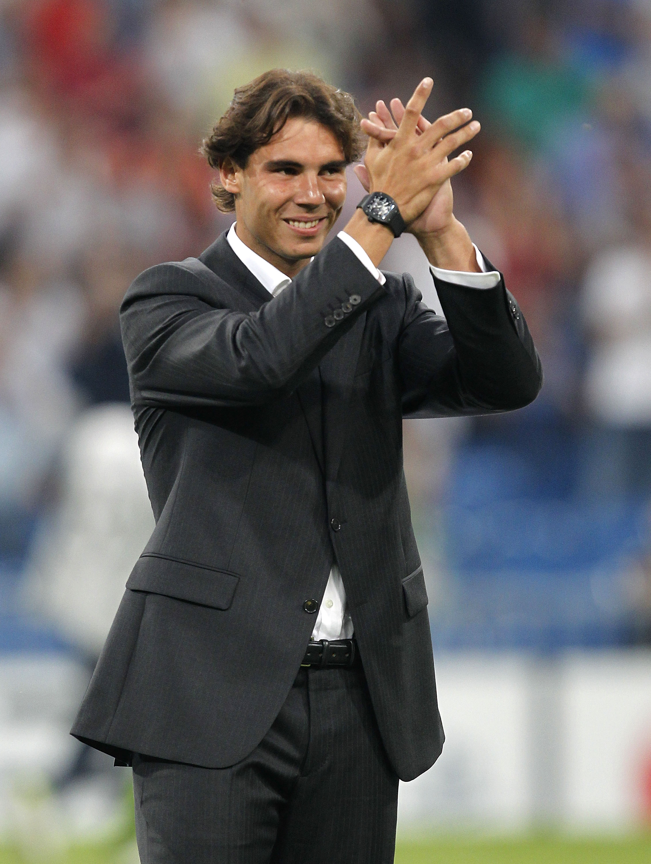 MADRID, SPAIN - SEPTEMBER 15: Tennis player Rafael Nadal greets prior to the start of the UEFA Champions League group G match between Real Madrid and AFC Ajax at Estadio Santiago Bernabeu on September 15, 2010 in Madrid, Spain. (Photo by Angel Martinez/Ge