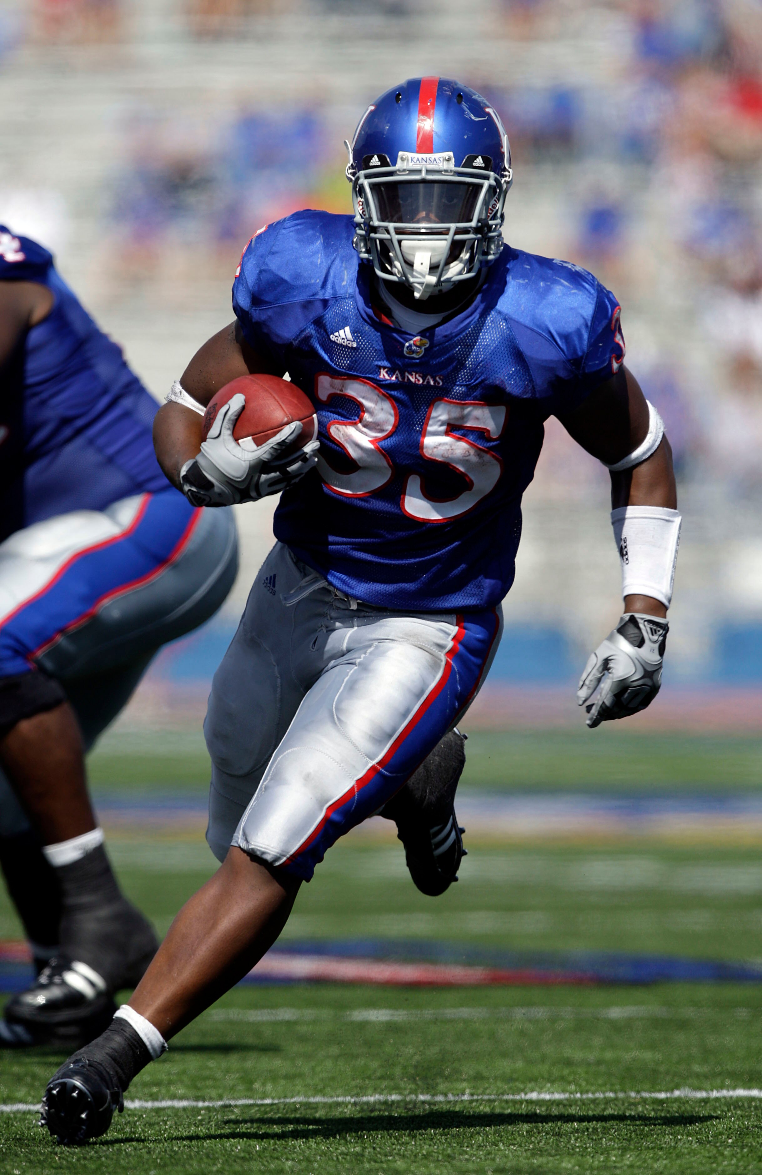 LAWRENCE, KS - SEPTEMBER 19:  Running back Toben Opurum #35 of the Kansas Jayhawks carries the ball upfield  during the game against the Duke Blue Devils on Kivisto Field at Memorial Stadium on September 19, 2009 in Lawrence, Kansas.  (Photo by Jamie Squi