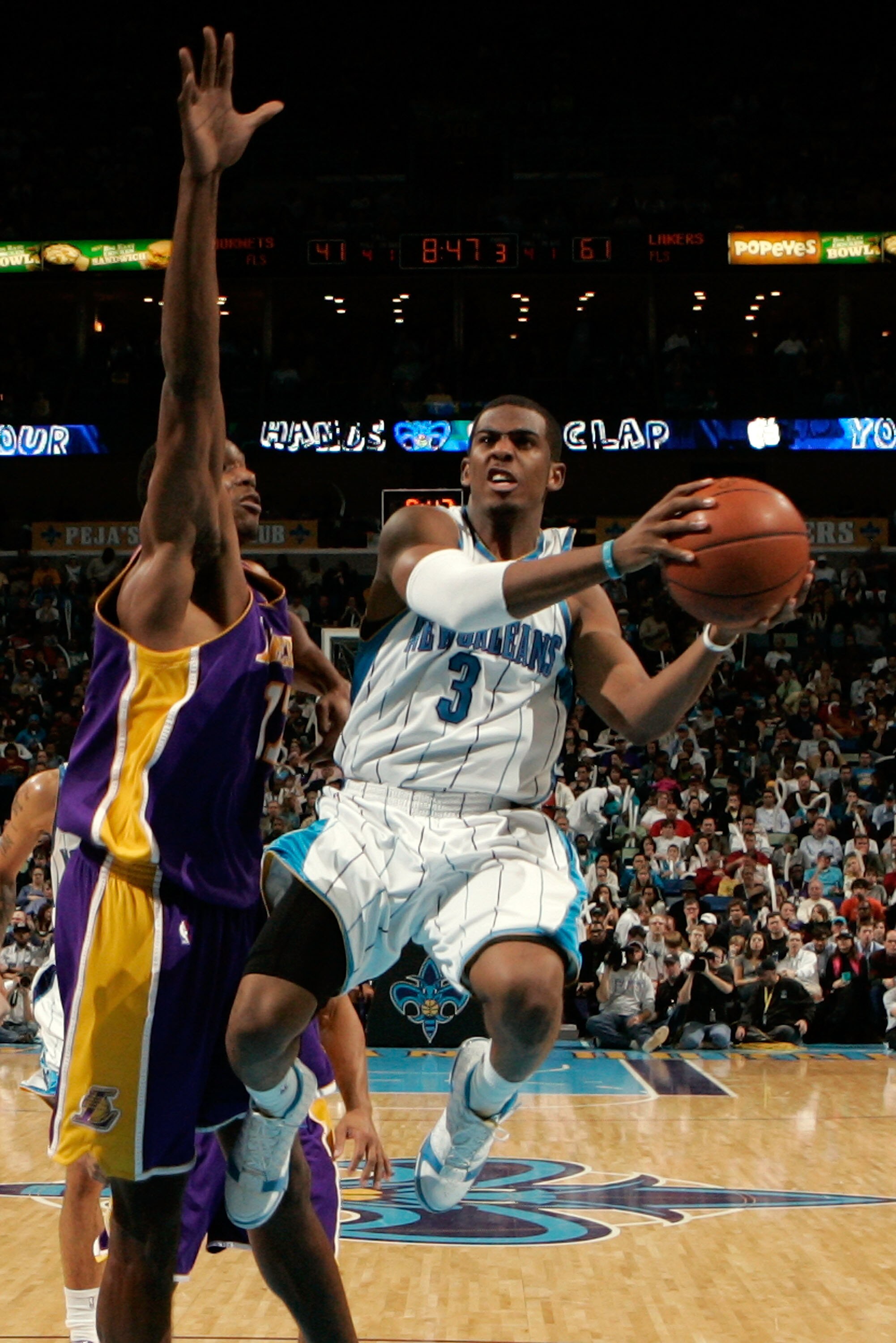NEW ORLEANS - DECEMBER 23: Chris Paul #3 of the New Orleans Hornets makes a shot over Andrew Bynum #17 of the Los Angeles Lakers on December 23, 2008 at the New Orleans Arena in New Orleans, Louisiana. The Lakers defeated the Hornets 100-87. NOTE TO US NEW ORLEANS - DECEMBER 23: Chris Paul #3 of the New Orleans Hornets makes a shot over Andrew Bynum #17 of the Los Angeles Lakers on December 23, 2008 at the New Orleans Arena in New Orleans, Louisiana. The Lakers defeated the Hornets 100-87. NOTE TO US