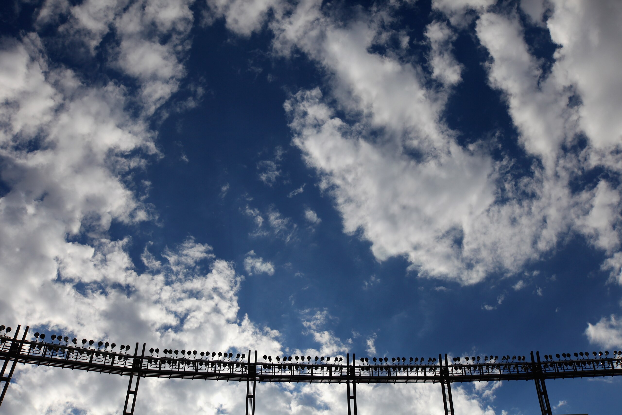 DENVER - AUGUST 21:  Stadium lights are at the ready as clouds filter the fading sun as the Denver Broncos host the Detroit Lions during preseason NFL action at INVESCO Field at Mile High on August 21, 2010 in Denver, Colorado.  (Photo by Doug Pensinger/G